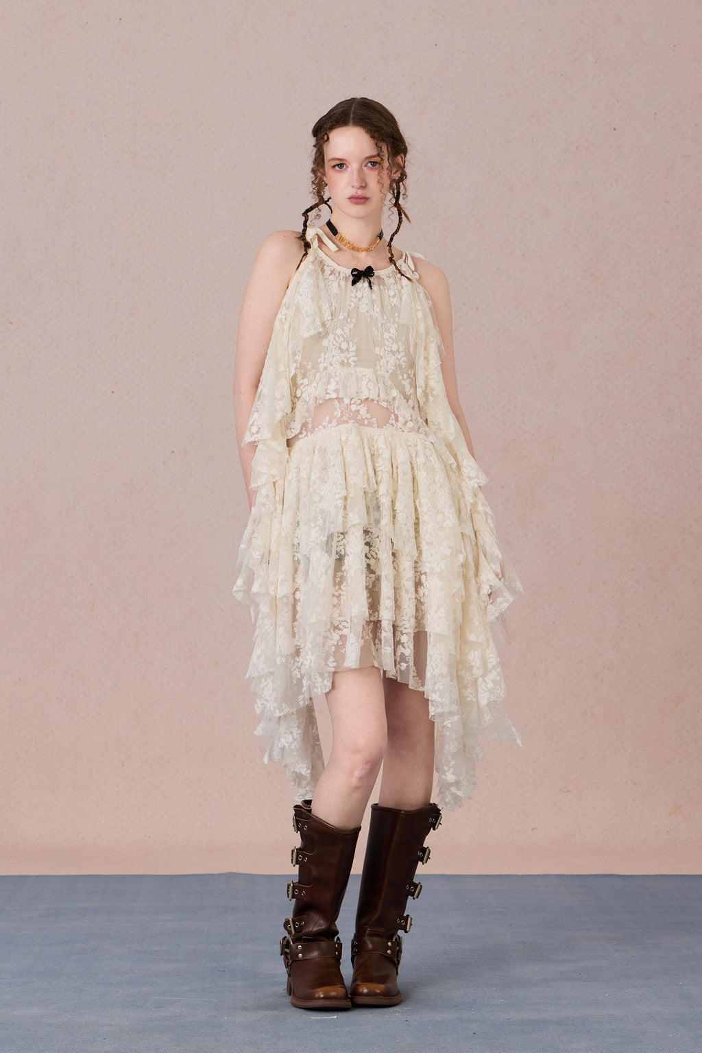 Model in fluttering battle-damaged lace dress with ruffled layers – WEANCHEAM