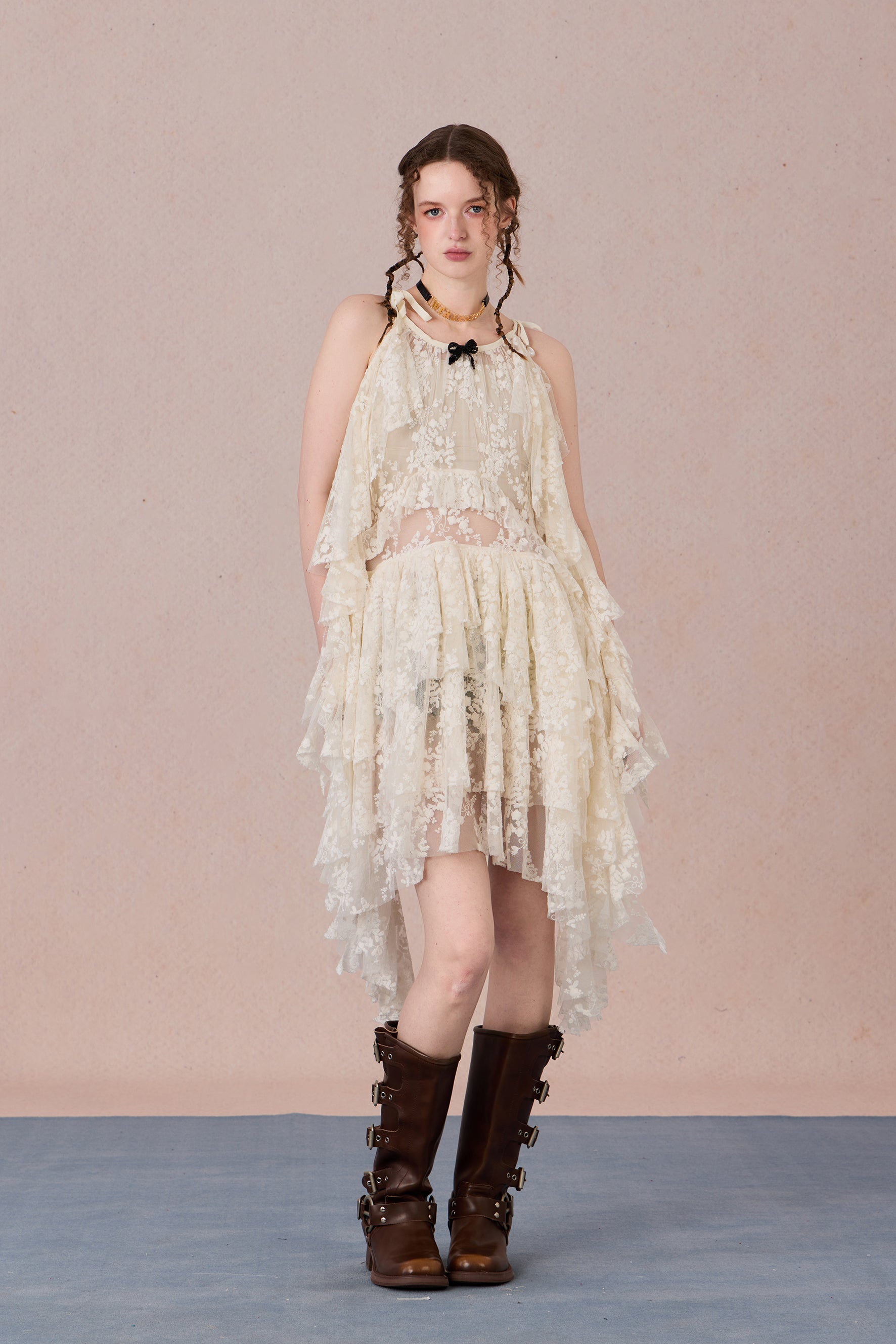 Model in fluttering battle-damaged lace dress with ruffled layers – WEANCHEAM