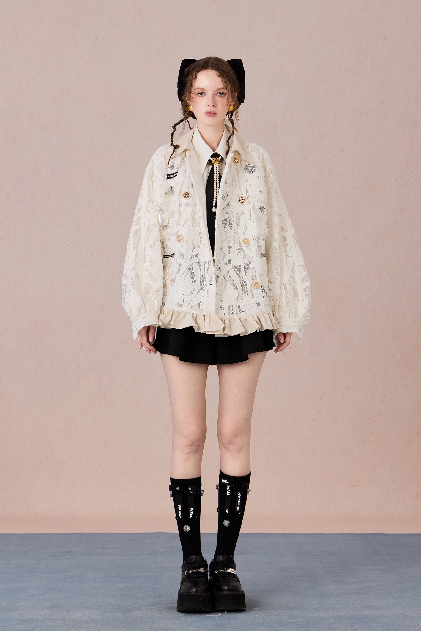 Romantic lace blazer with layered texture and loose fit silhouette
