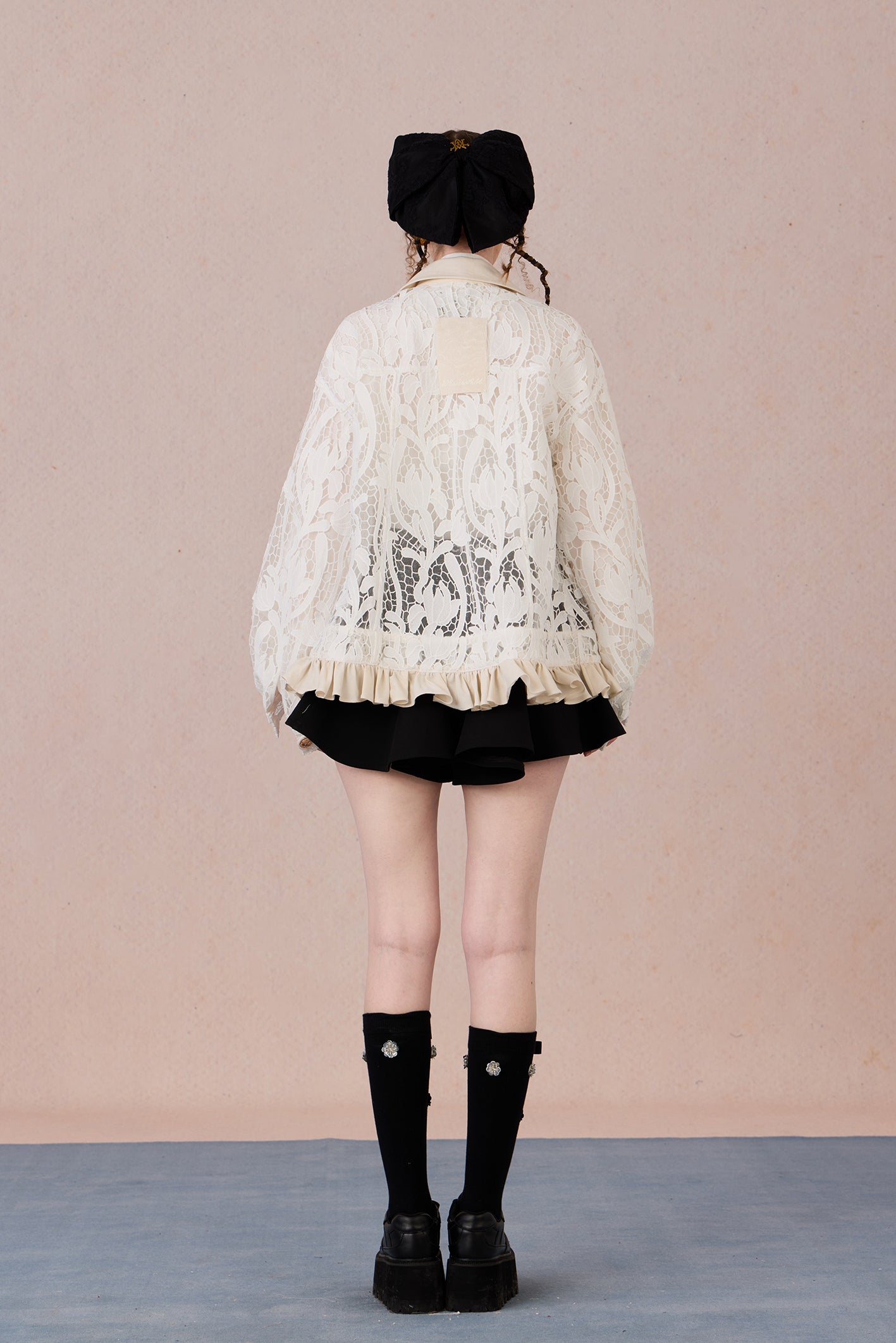 Romantic lace blazer with layered texture and loose fit silhouette