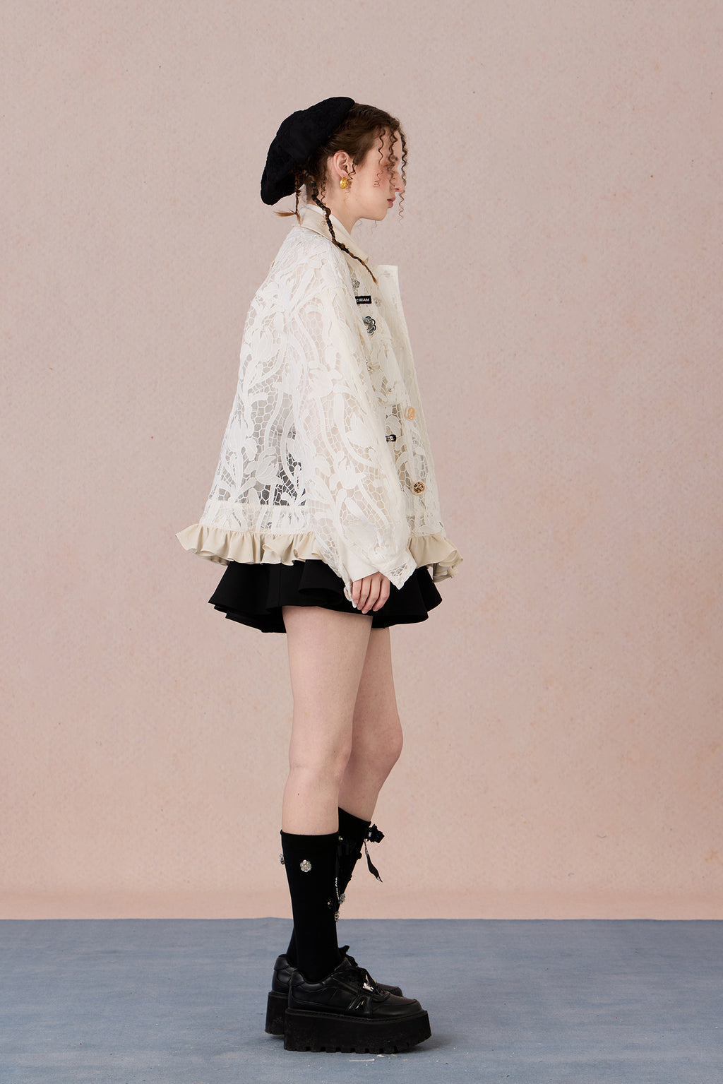 Romantic lace blazer with layered texture and loose fit silhouette