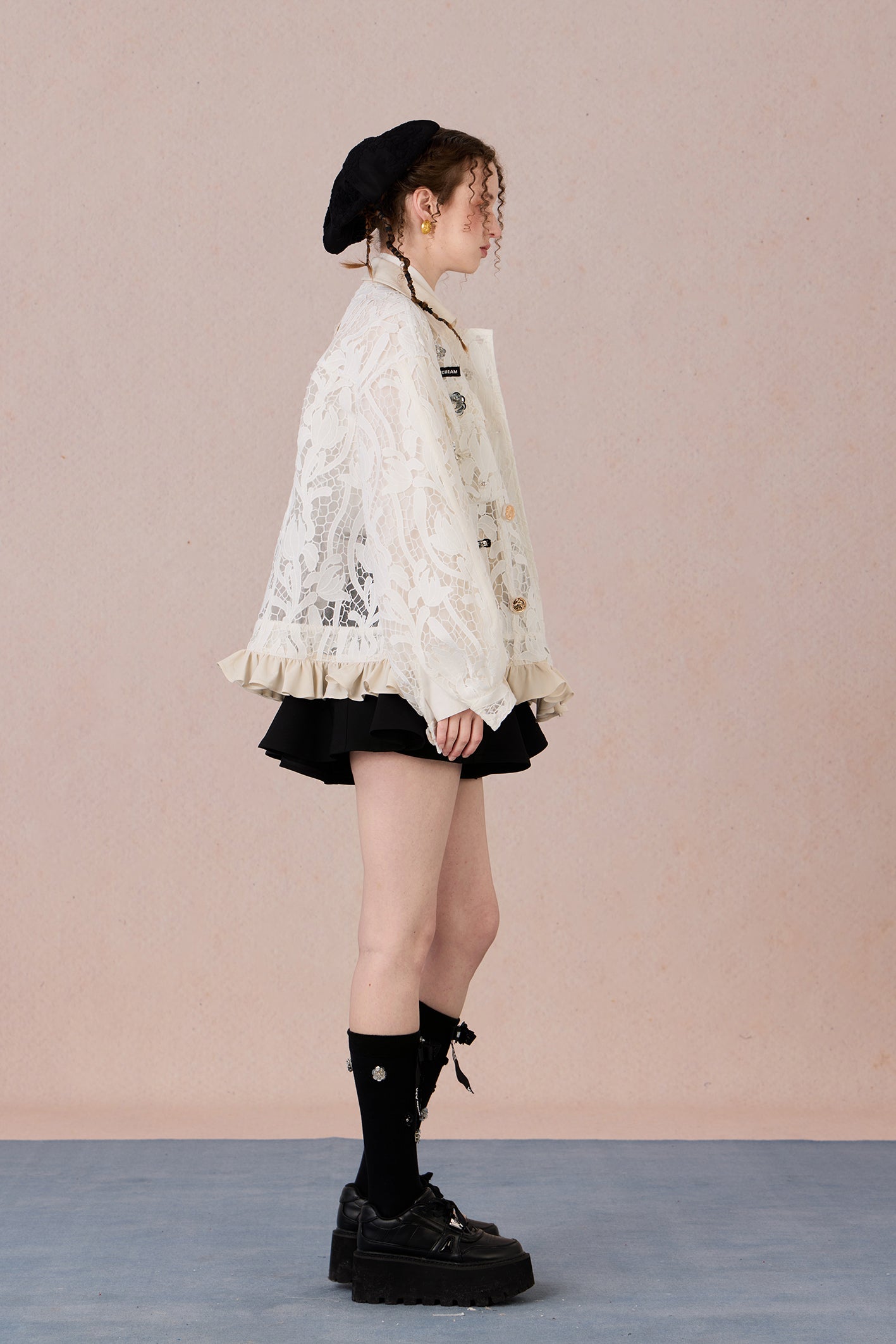 Romantic lace blazer with layered texture and loose fit silhouette