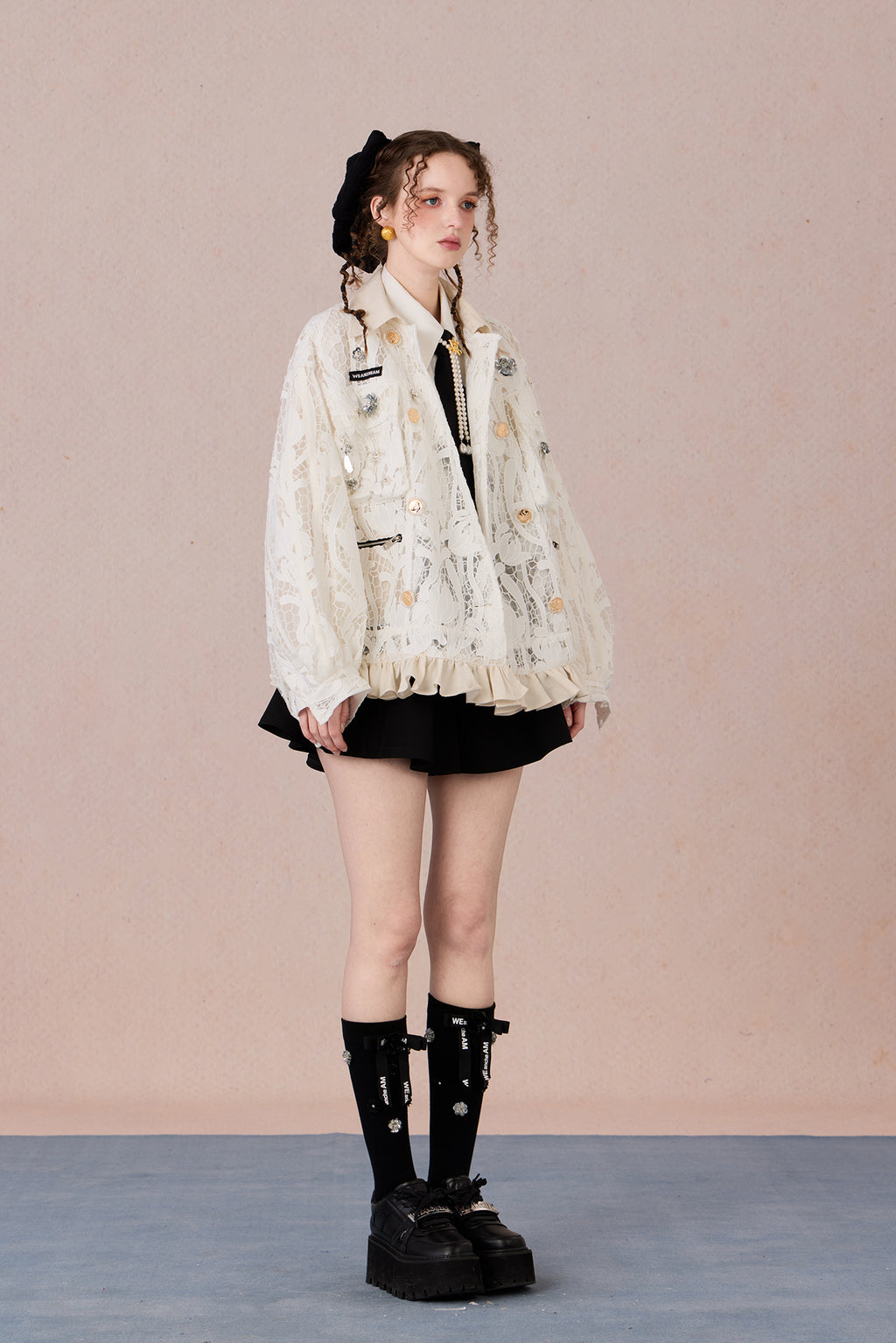 Romantic lace blazer with layered texture and loose fit silhouette