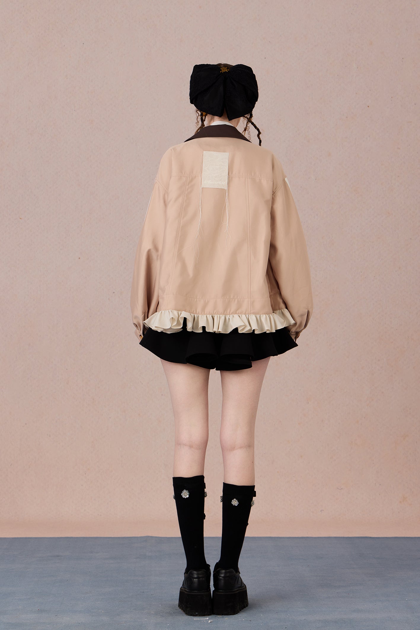 Romantic lace blazer with layered texture and loose fit silhouette