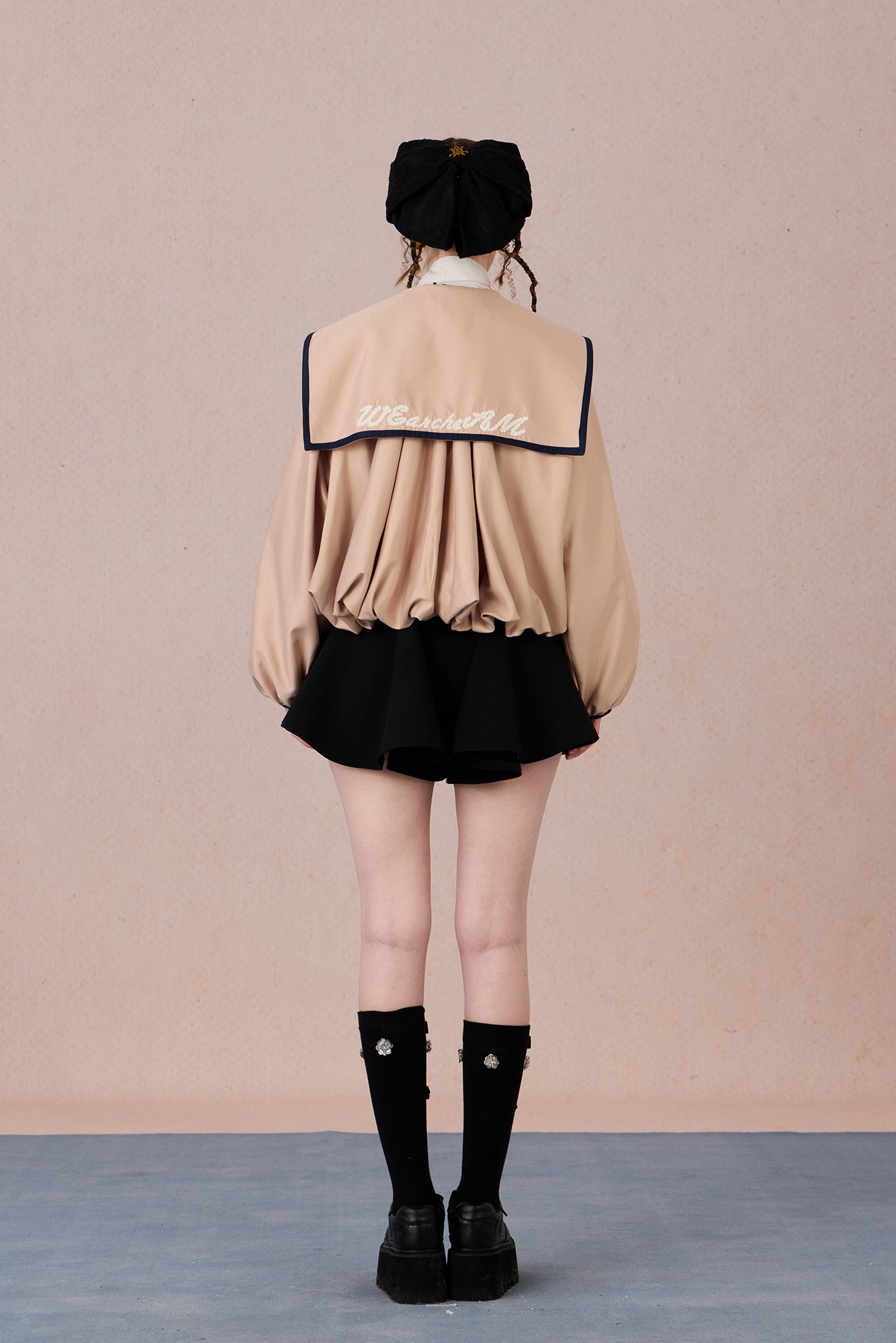 Flowing A-line hem of vintage sheer coat with soft drape