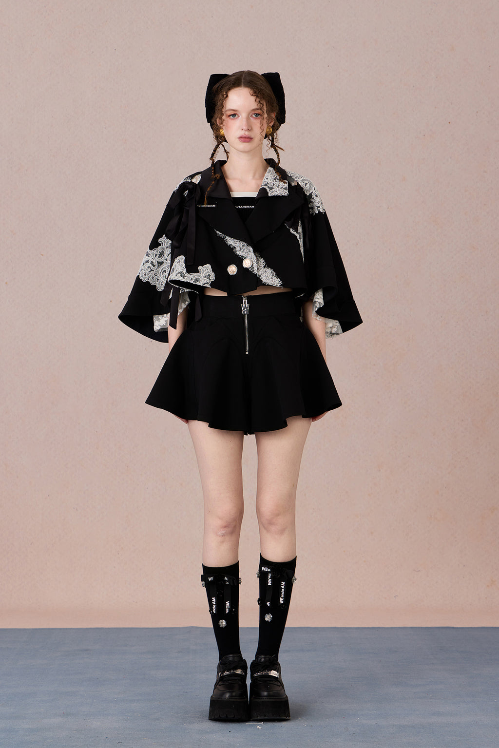 Short suit jacket with romantic lace trim and functional hood