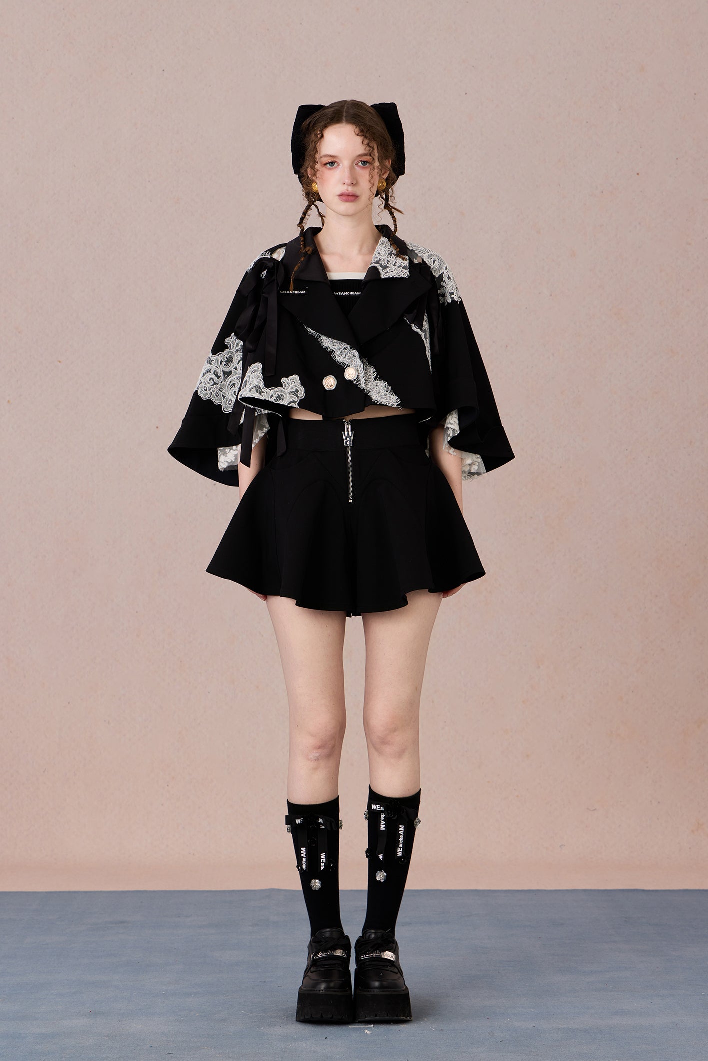 Short suit jacket with romantic lace trim and functional hood