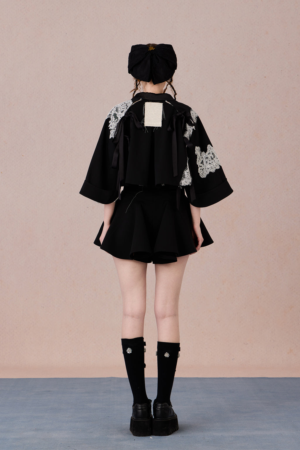  High-low hem lace jacket with adjustable fit and urban flair