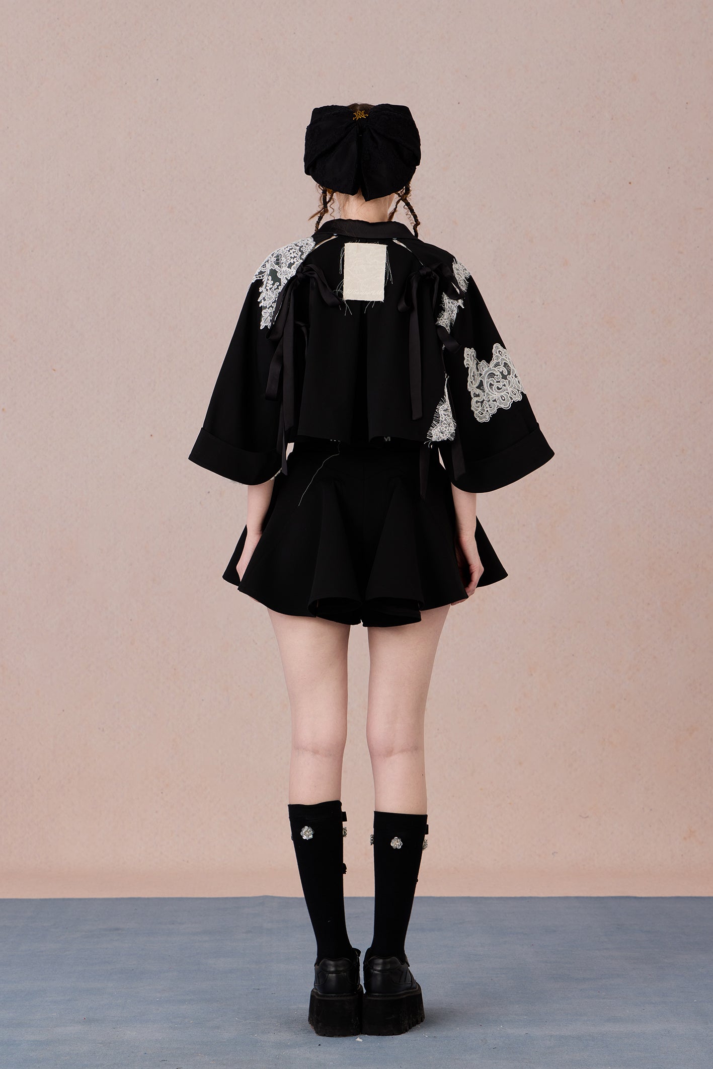  High-low hem lace jacket with adjustable fit and urban flair