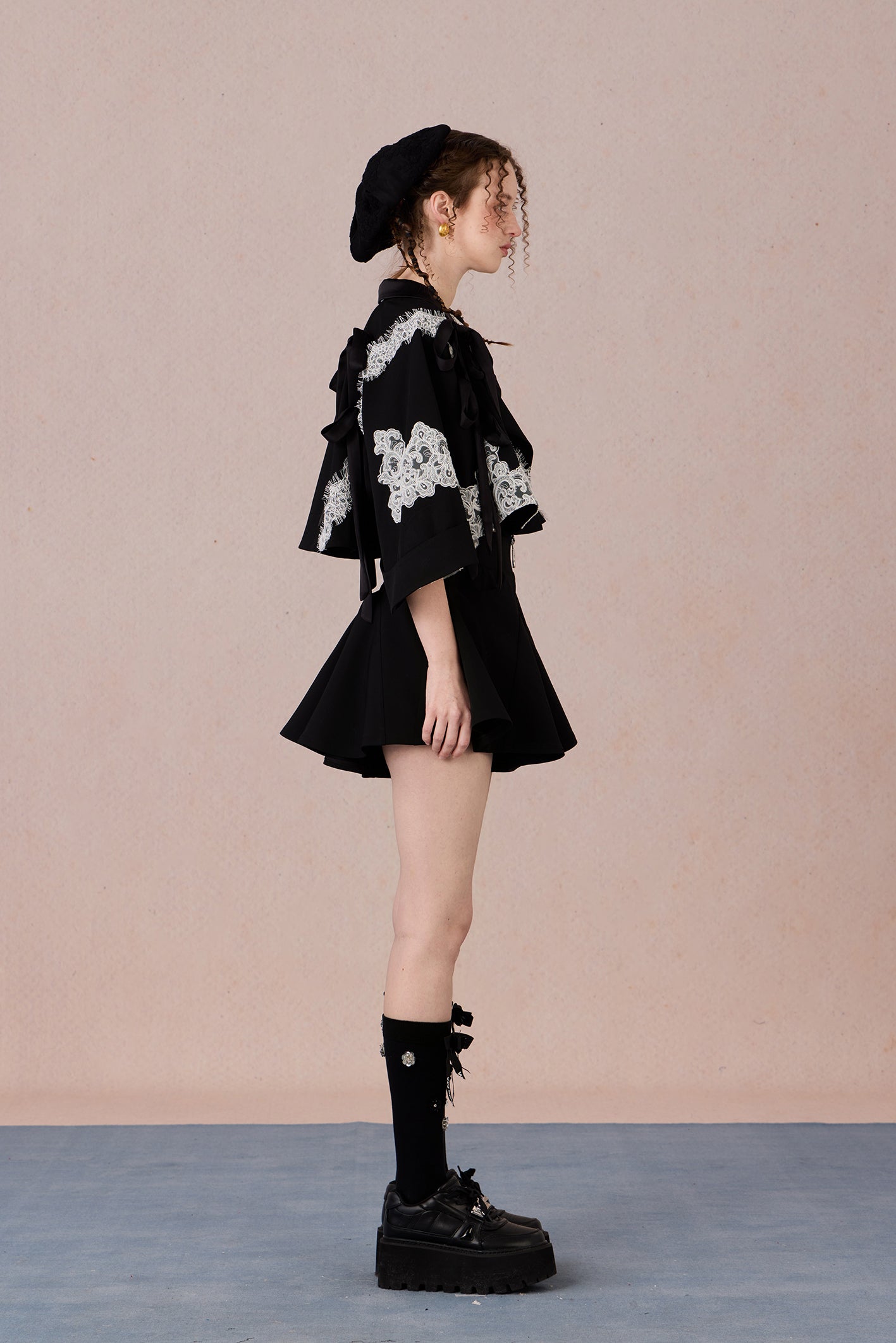 Short suit jacket with romantic lace trim and functional hood