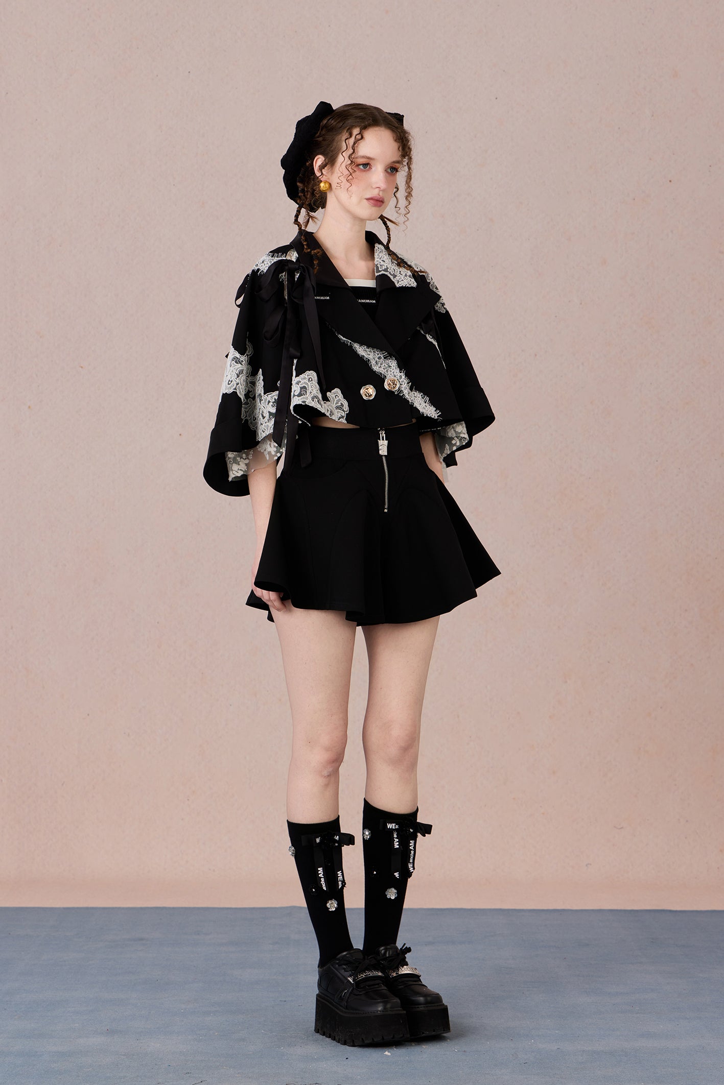 Short suit jacket with romantic lace trim and functional hood