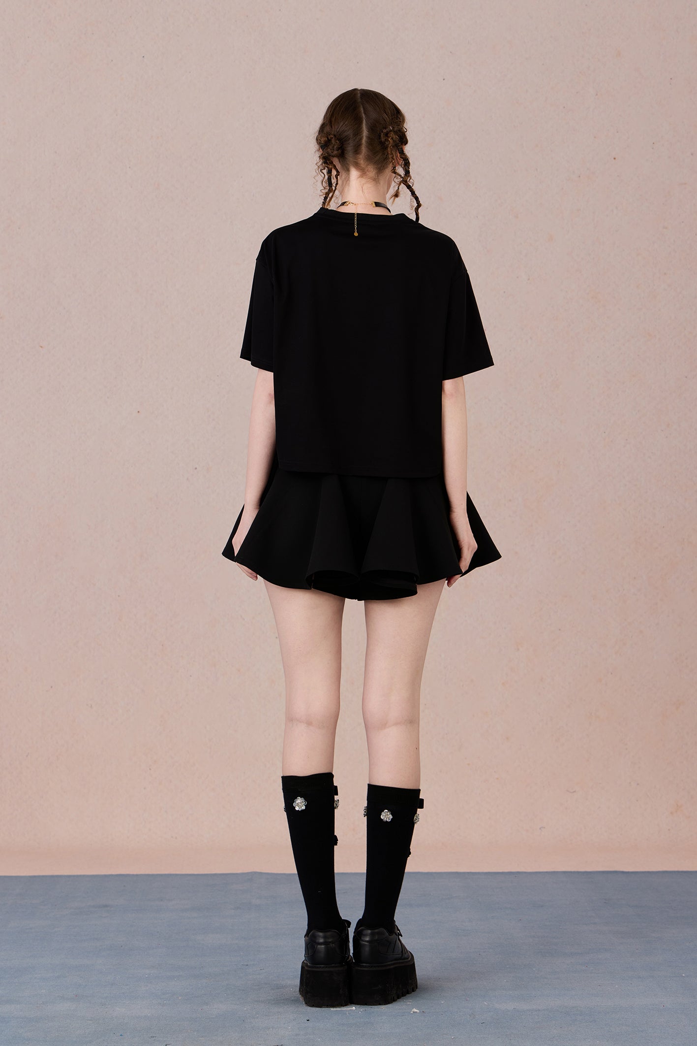 Loose fit round neck tee with bold red hand-beaded bow design