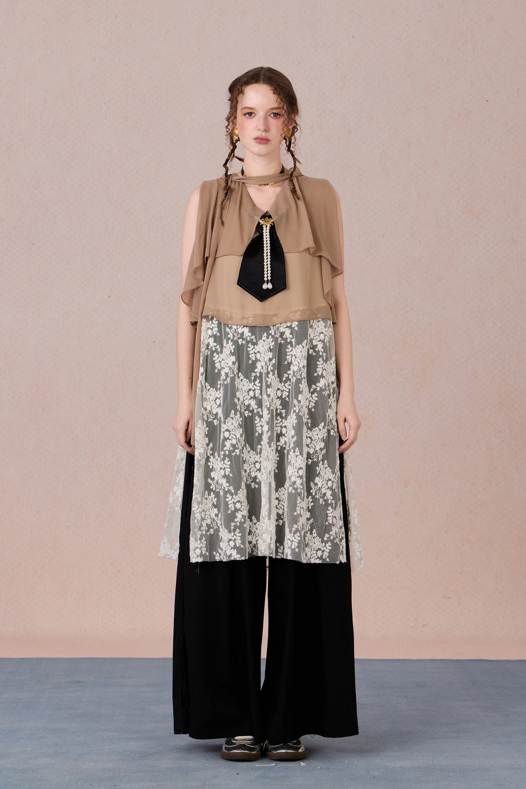 Model in semi-sheer layered blouse with contrast fabric and pearl detail – WEANCHEAM