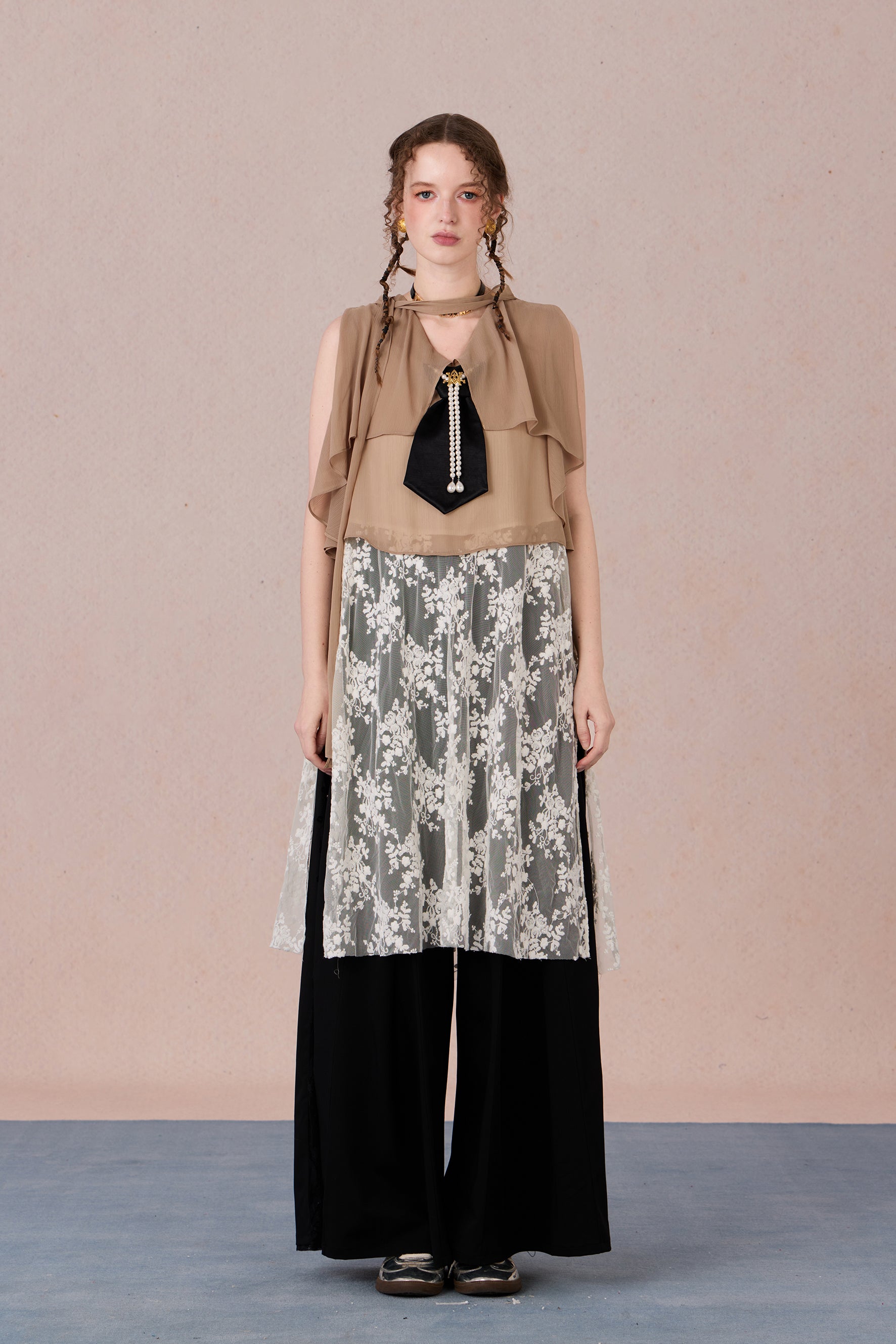 Model in semi-sheer layered blouse with contrast fabric and pearl detail – WEANCHEAM