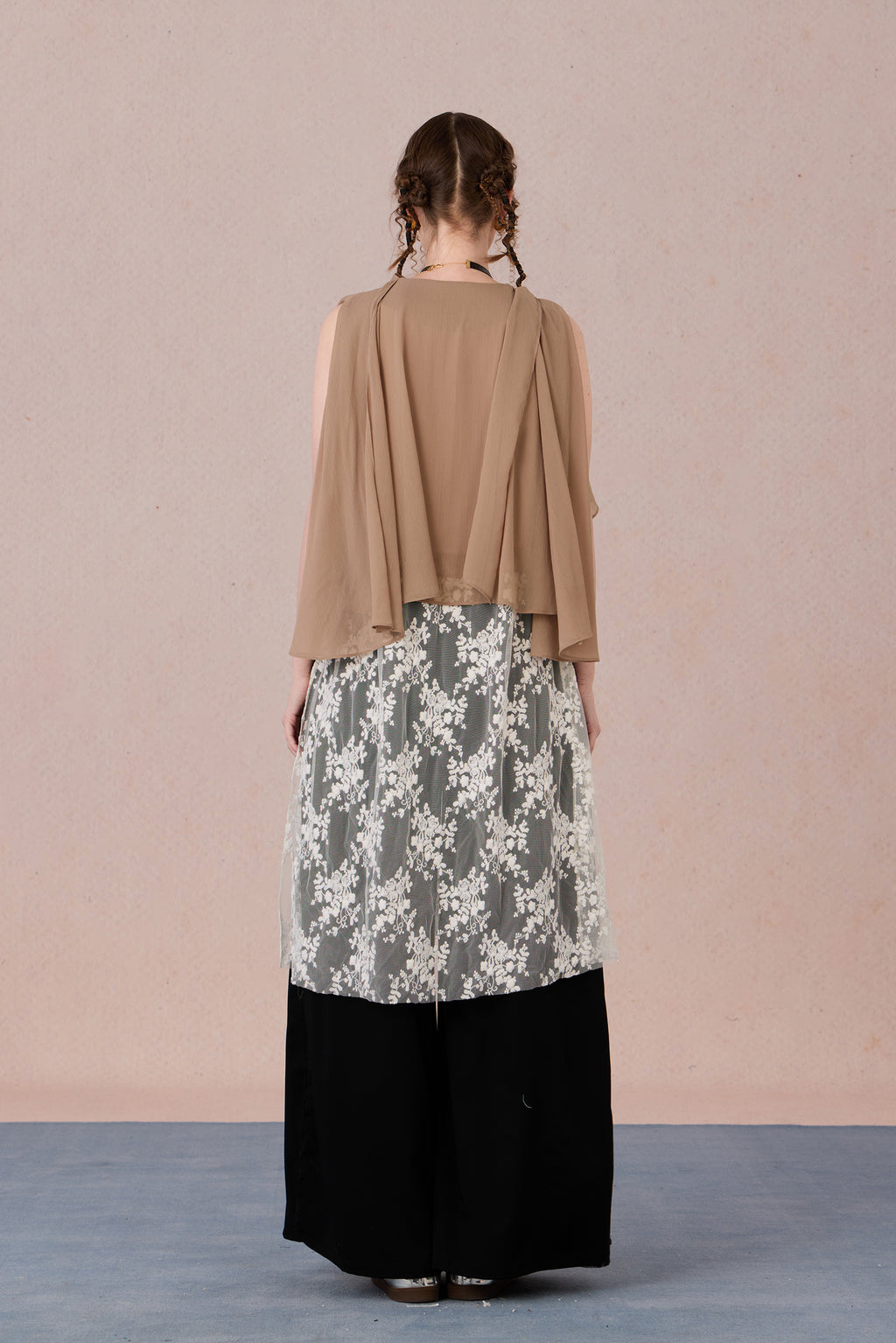 Back view of lightweight sheer-hem blouse with relaxed drape – WEANCHEAM