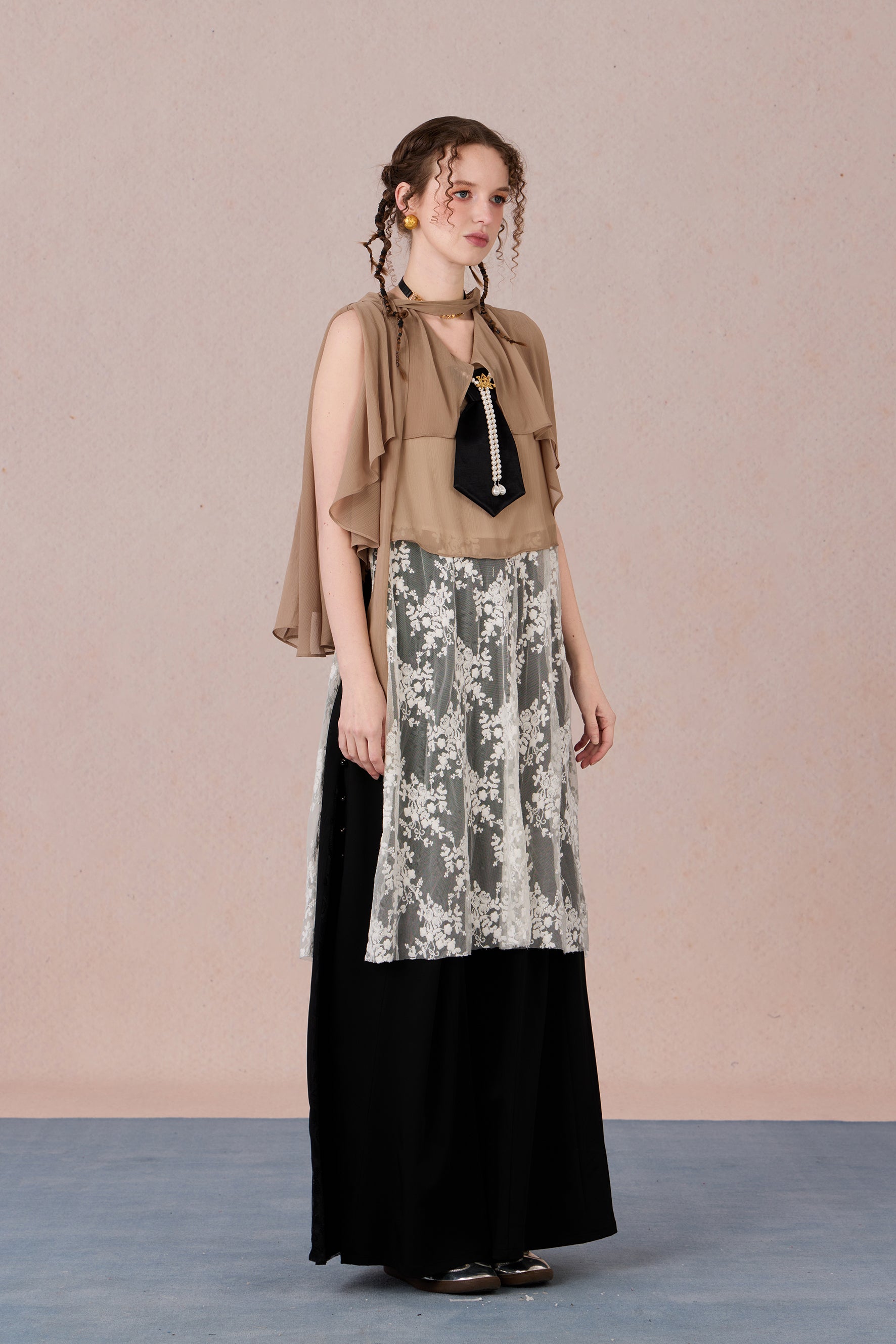 Model in semi-sheer layered blouse with contrast fabric and pearl detail – WEANCHEAM