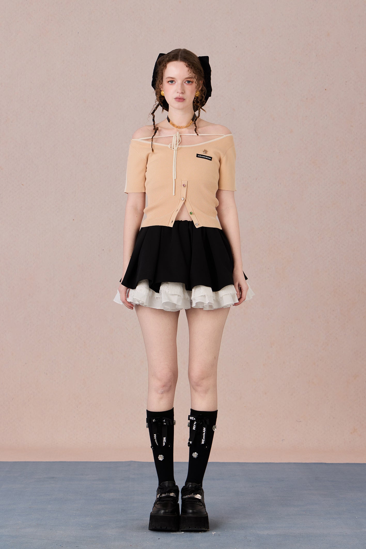 Slim bow tie top styled with trousers for evening wear