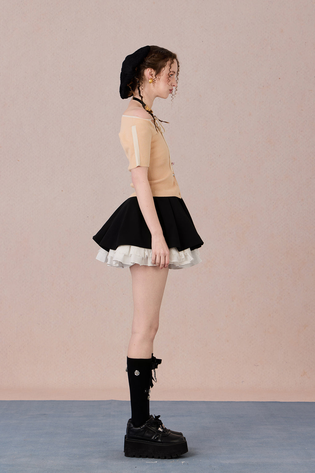 Slim bow tie top styled with trousers for evening wear