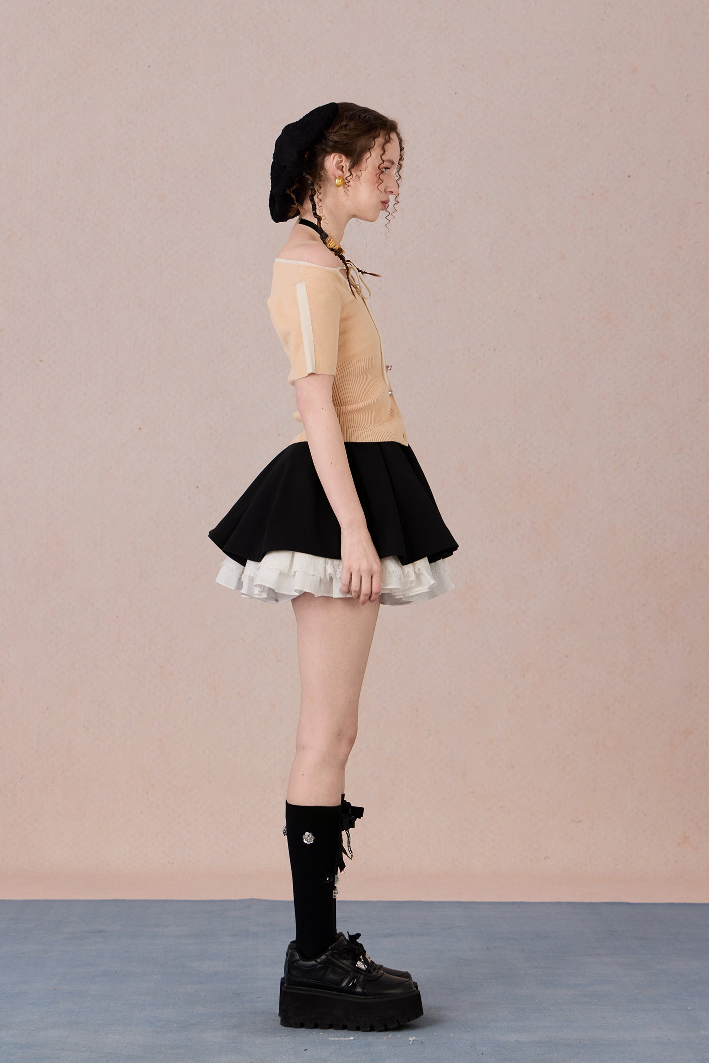 Slim bow tie top styled with trousers for evening wear