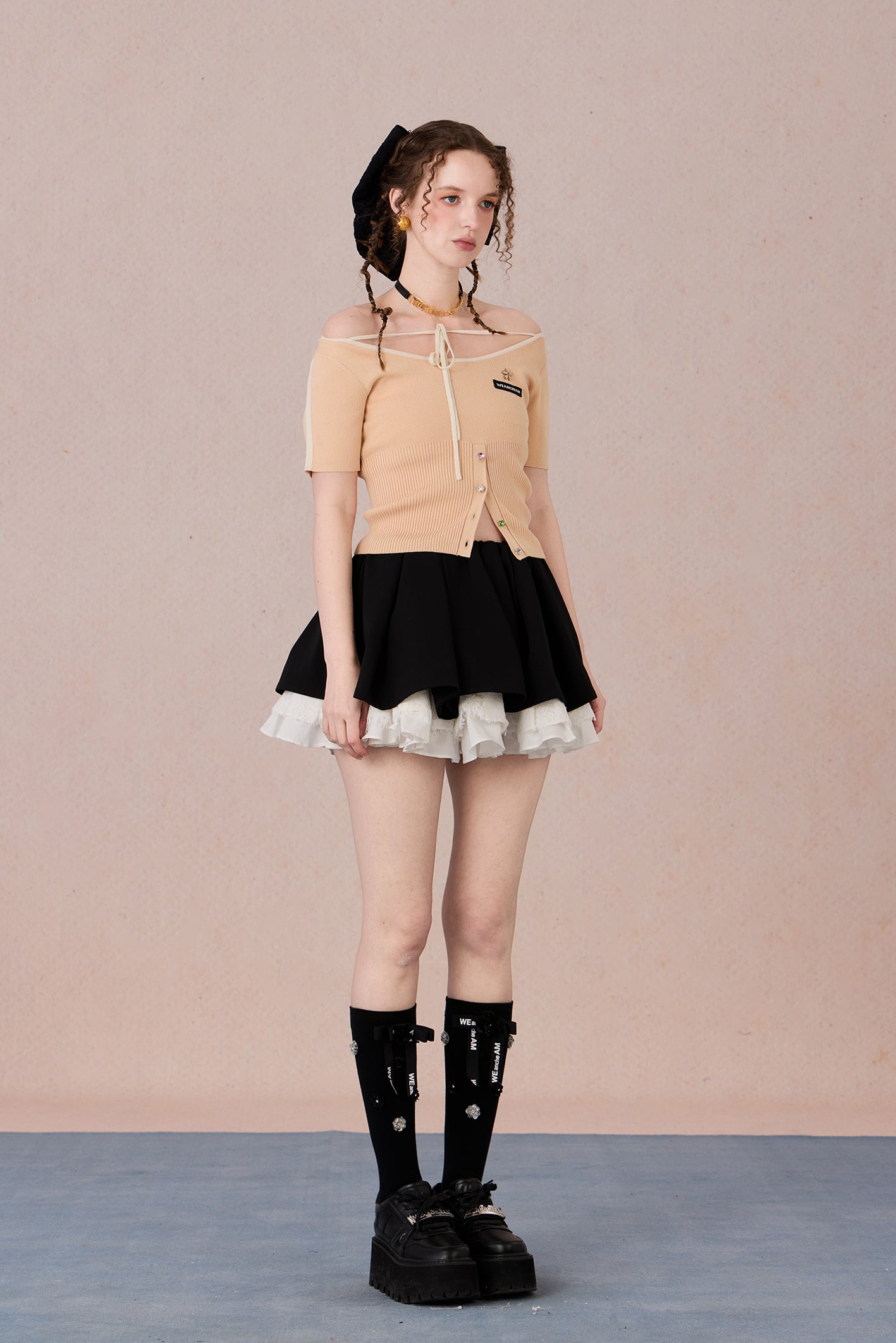 Slim bow tie top styled with trousers for evening wear
