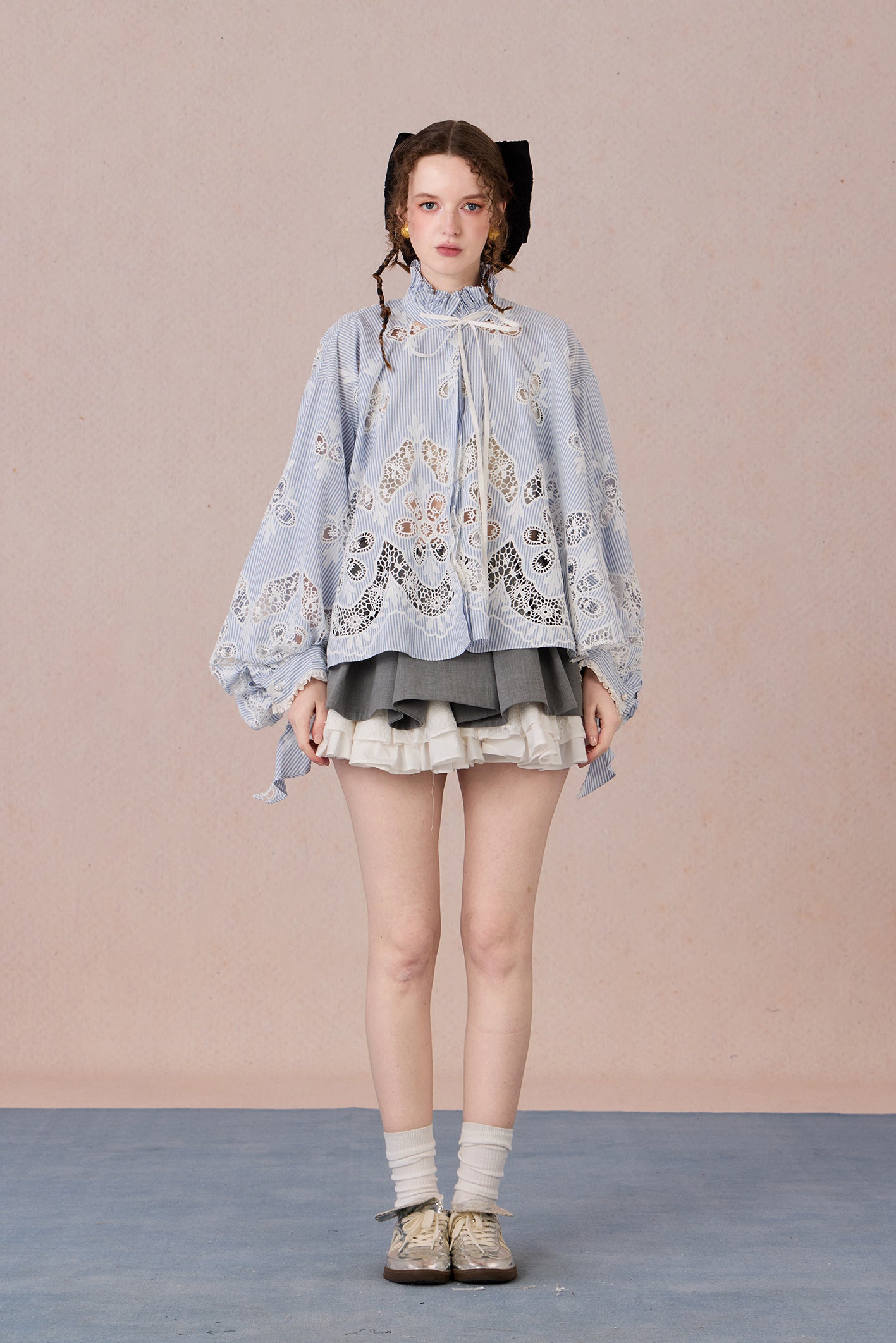 Flowing romantic shirt with beaded floral details and ruffled cuffs