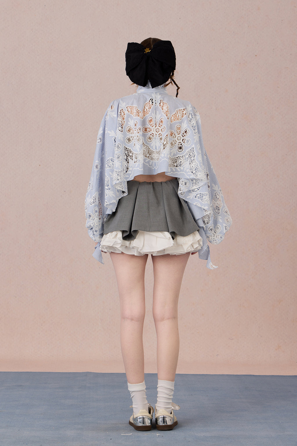 Flowing romantic shirt with beaded floral details and ruffled cuffs