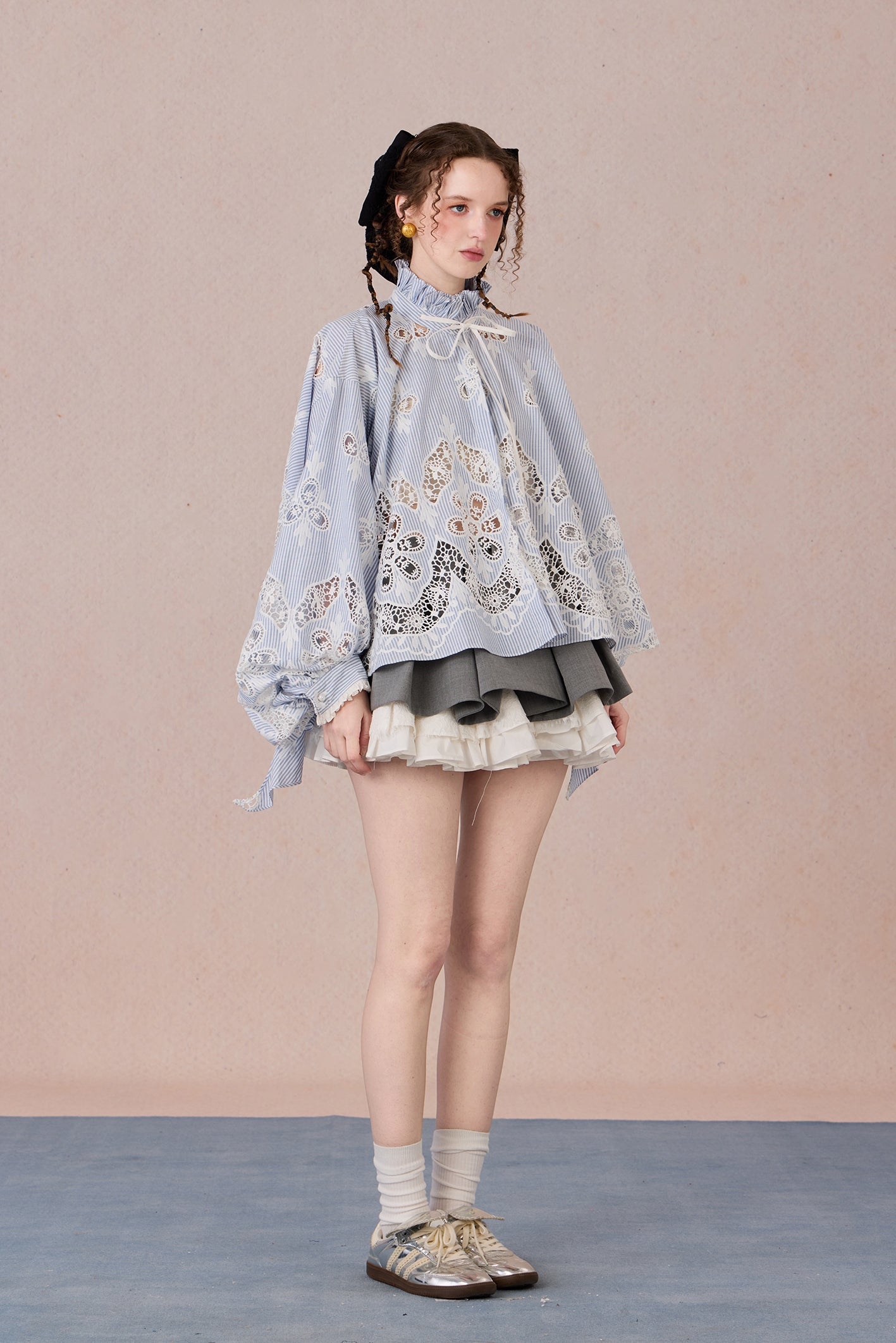 Flowing romantic shirt with beaded floral details and ruffled cuffs