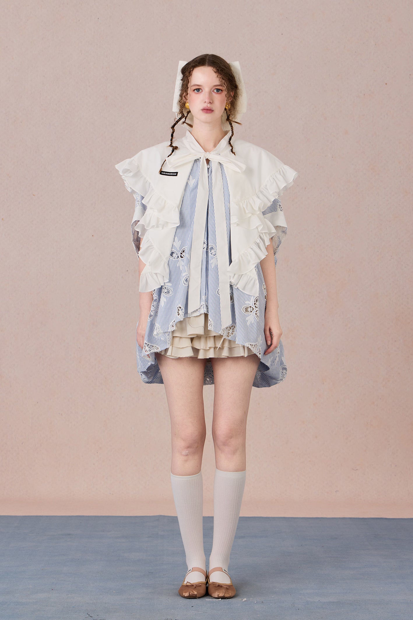 Flowing robe-style layering jacket with pearl sheen and soft lapels