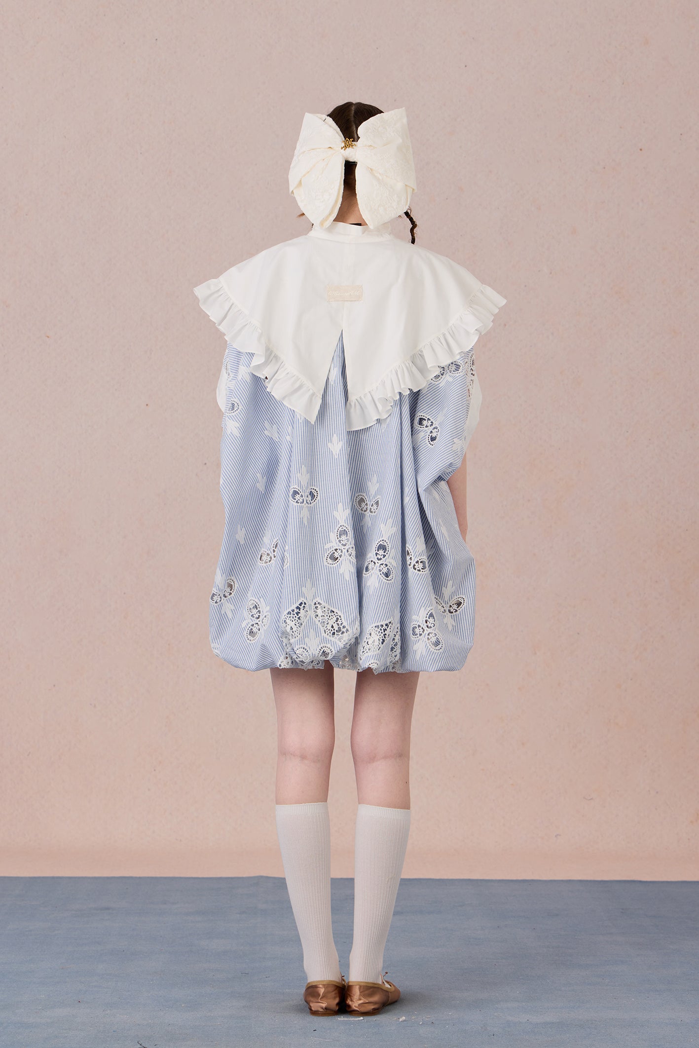 Lightweight robe coat with draped silhouette and feminine ruffle trims