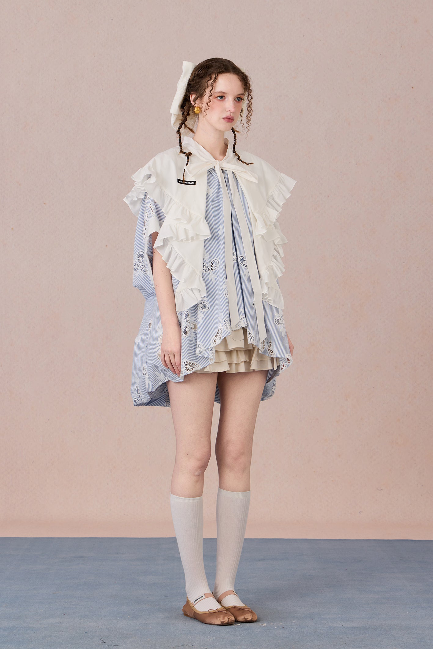 Flowing robe-style layering jacket with pearl sheen and soft lapels