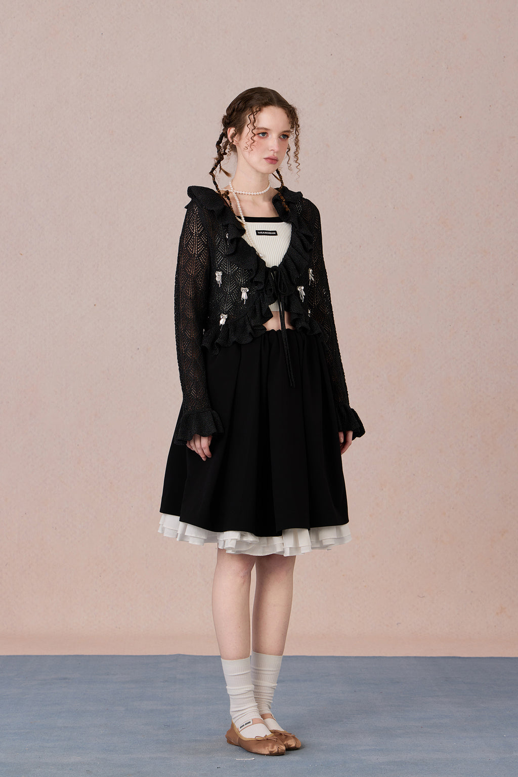Feminine spring knit jacket styled with skirt