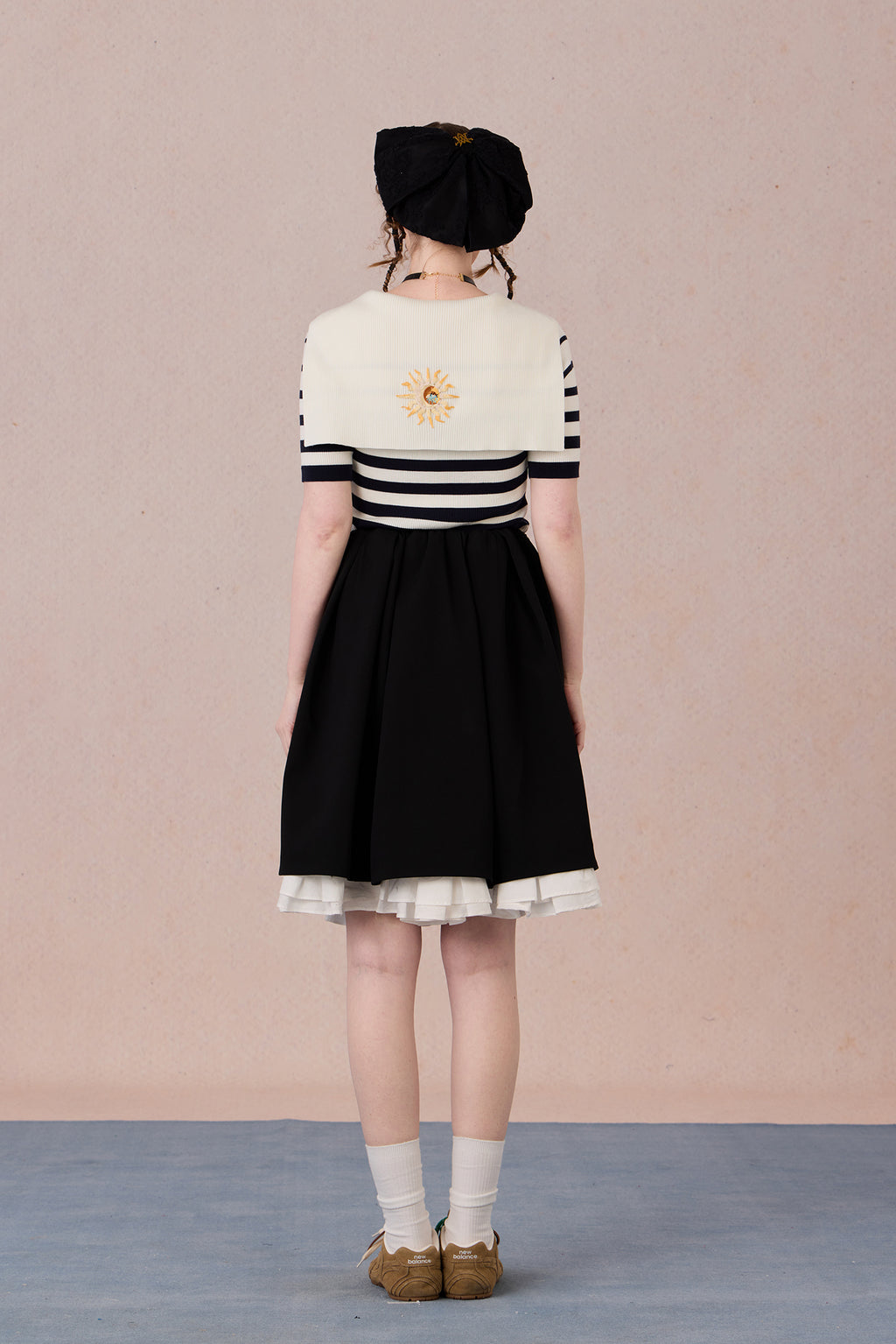  Hand-embroidered motif on striped jersey fabric