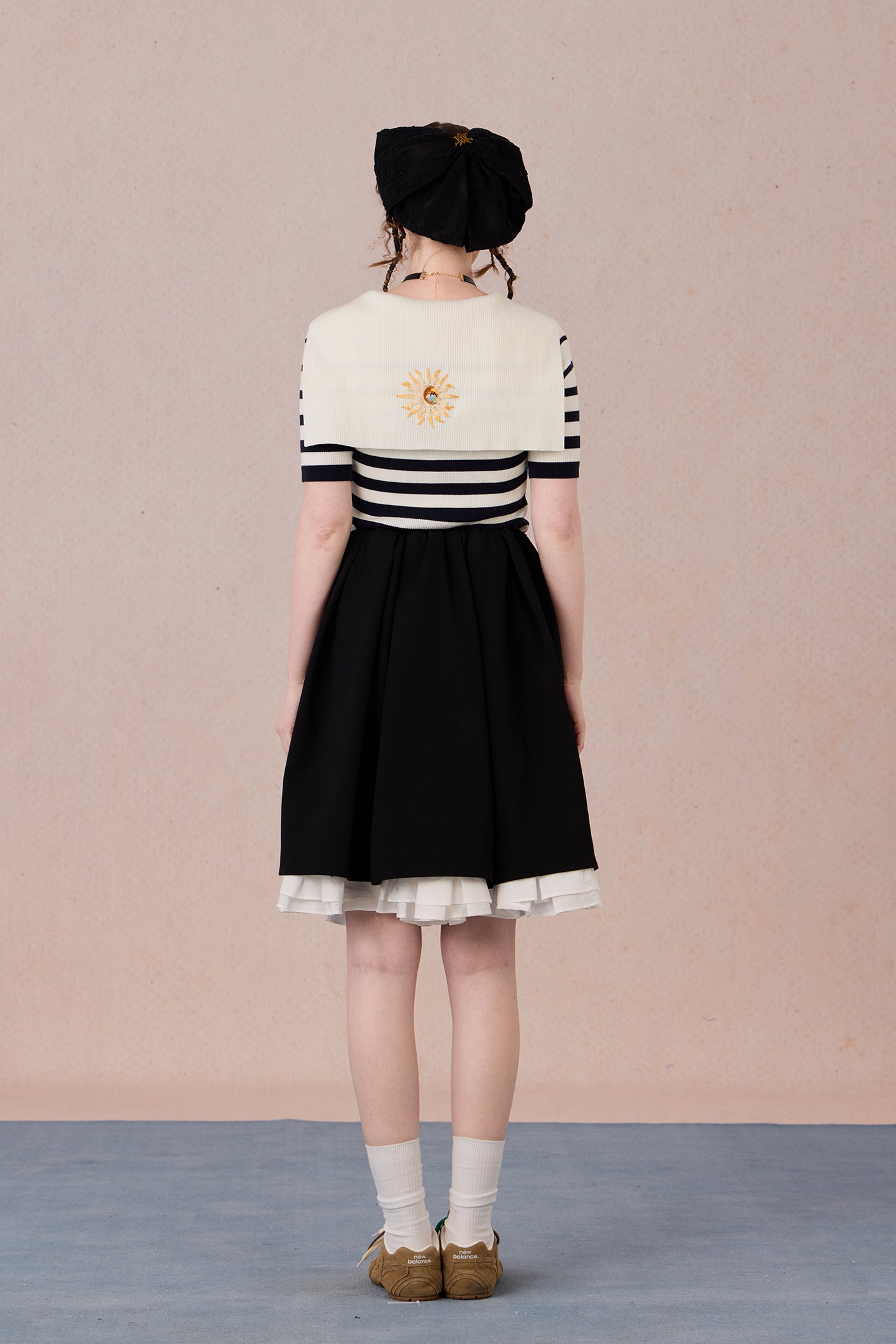  Hand-embroidered motif on striped jersey fabric