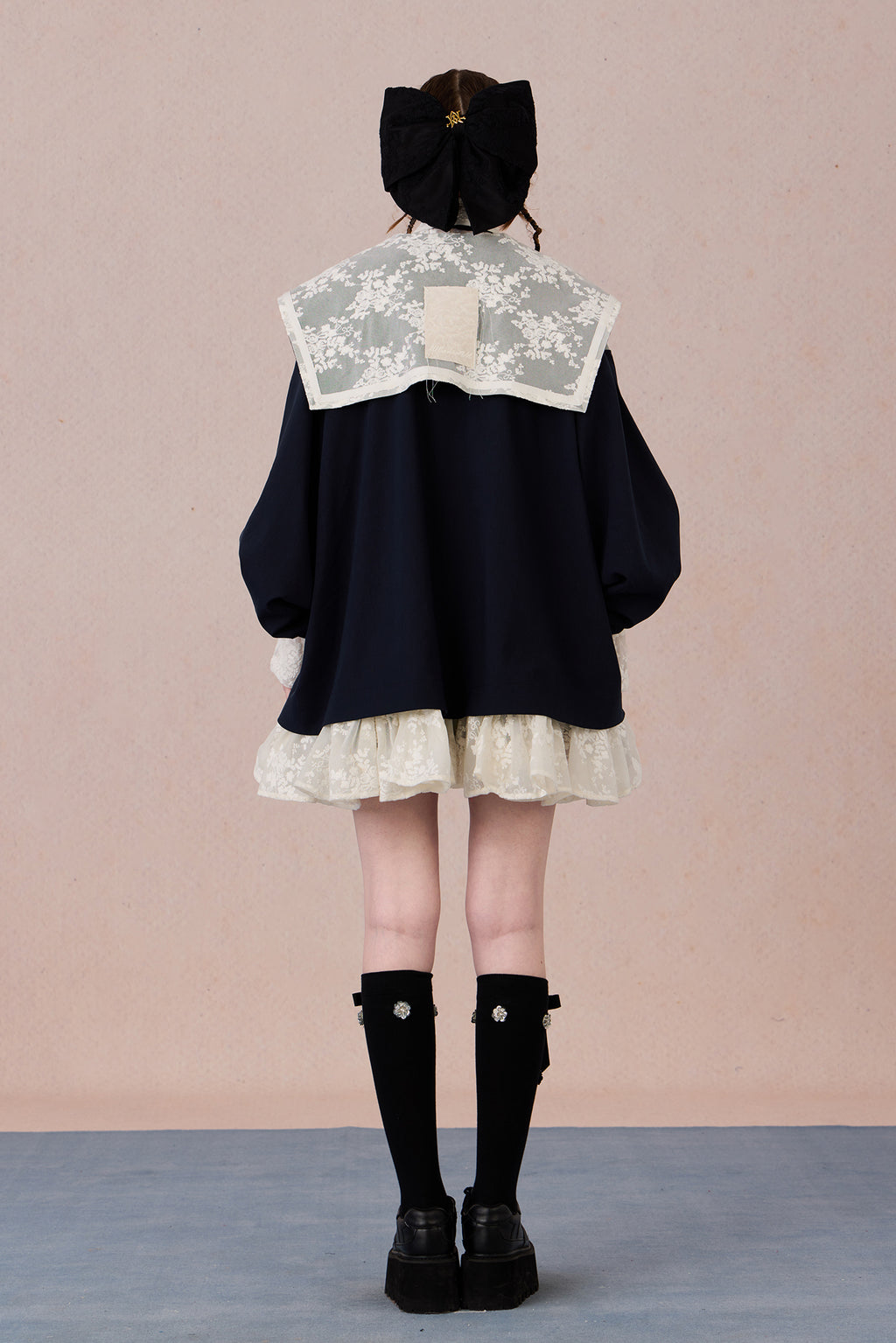 Ruffled hem chiffon jacket with lace appliqué and soft pearl luster