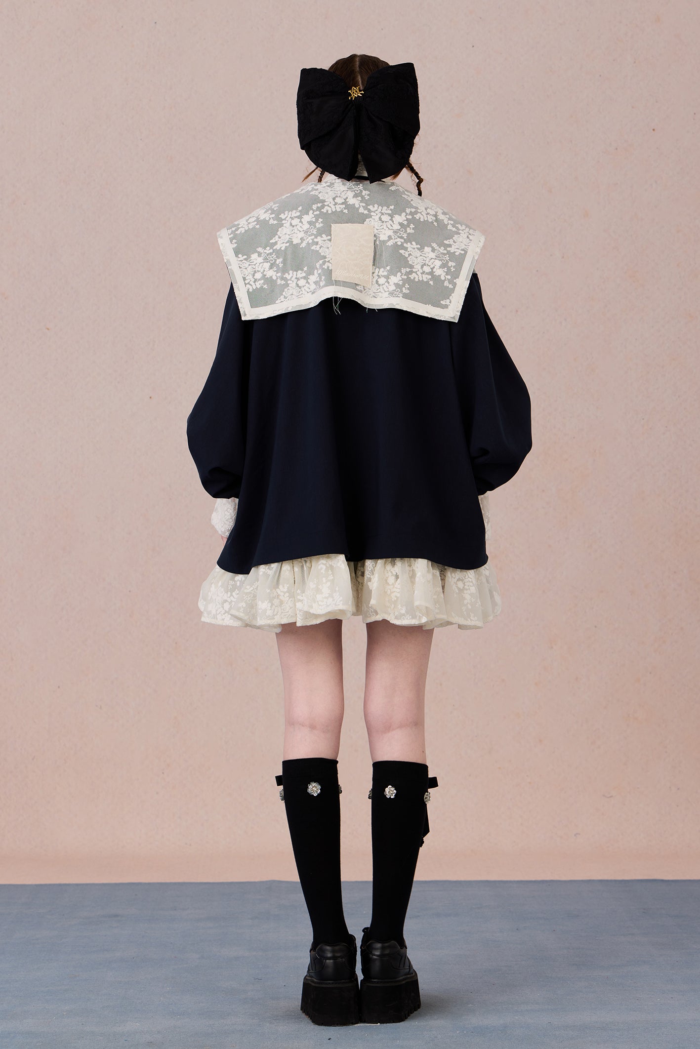 Ruffled hem chiffon jacket with lace appliqué and soft pearl luster