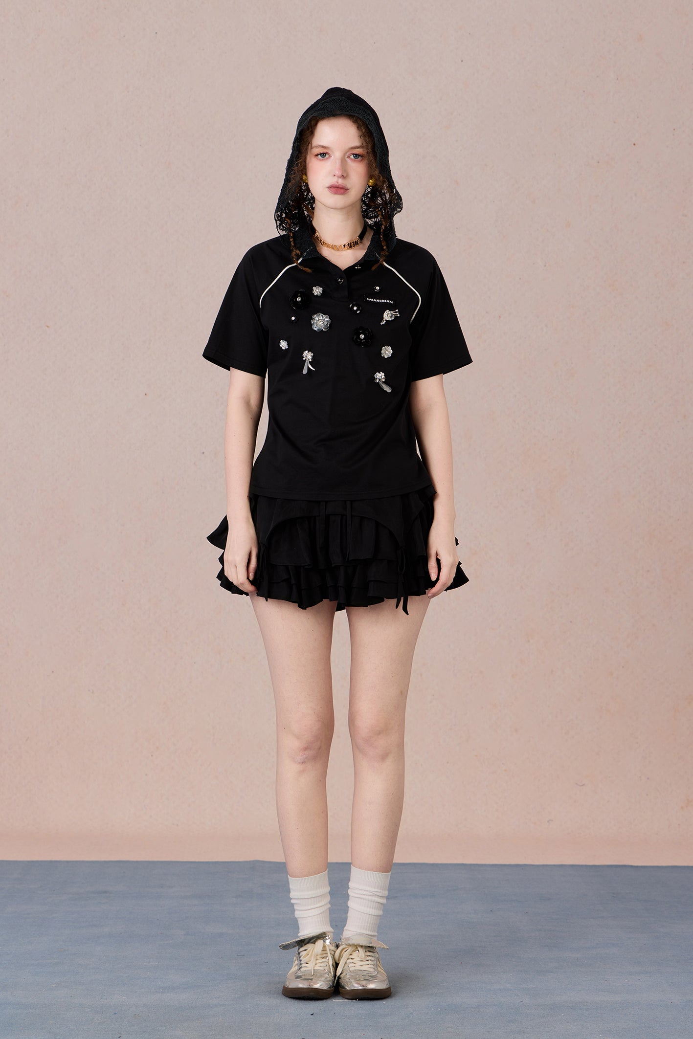 Feminine short sleeve embellished tee with soft drape and casual elegance