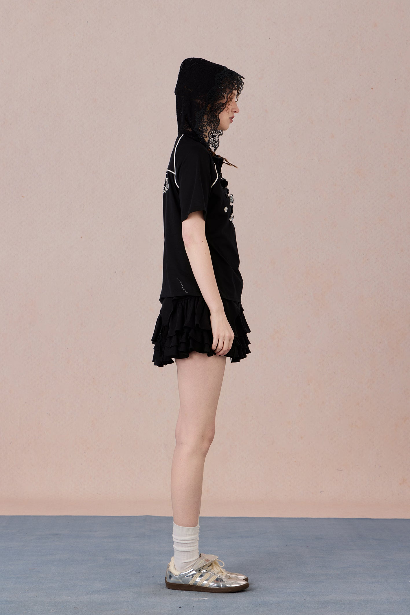 Feminine short sleeve embellished tee with soft drape and casual elegance