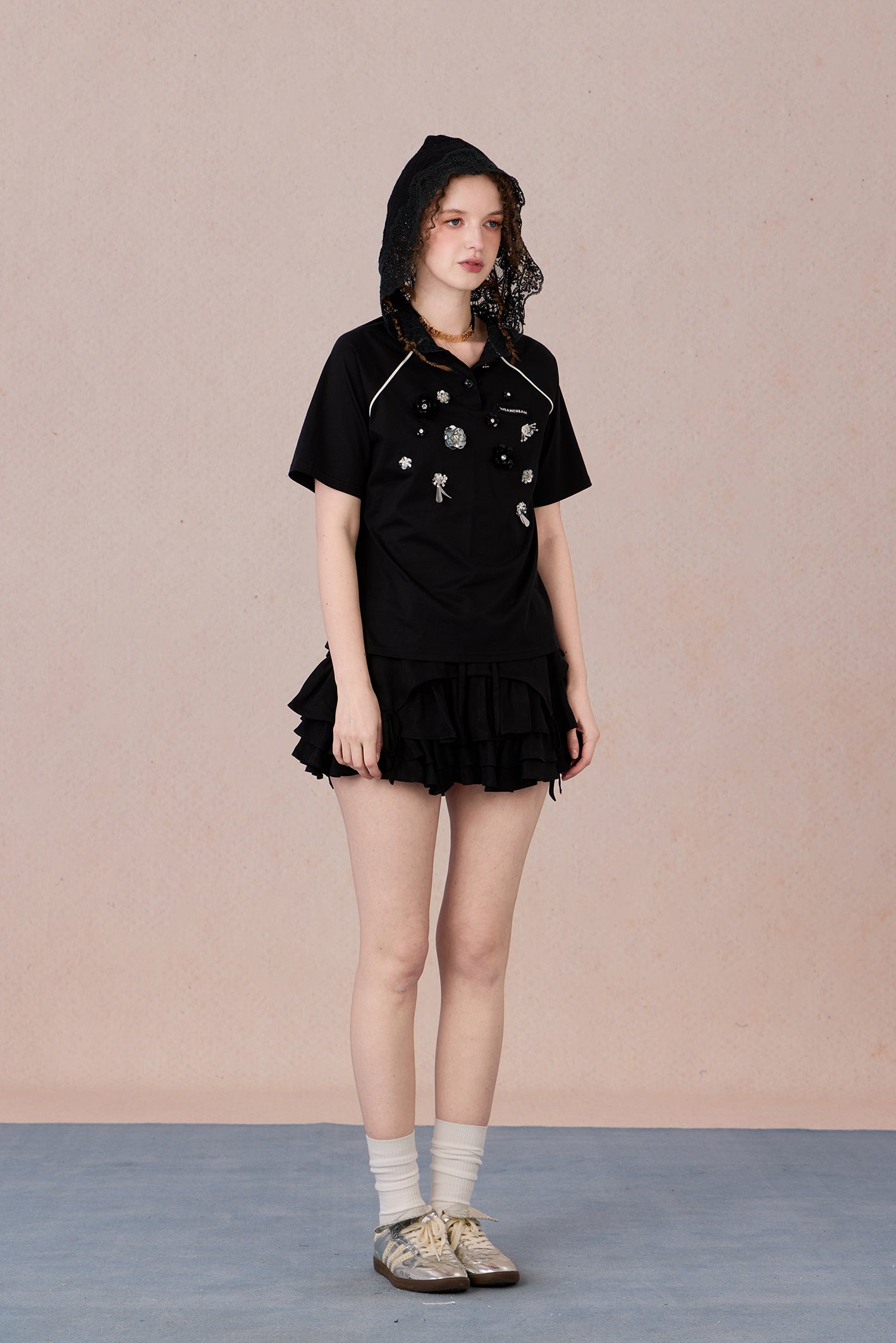 Feminine short sleeve embellished tee with soft drape and casual elegance
