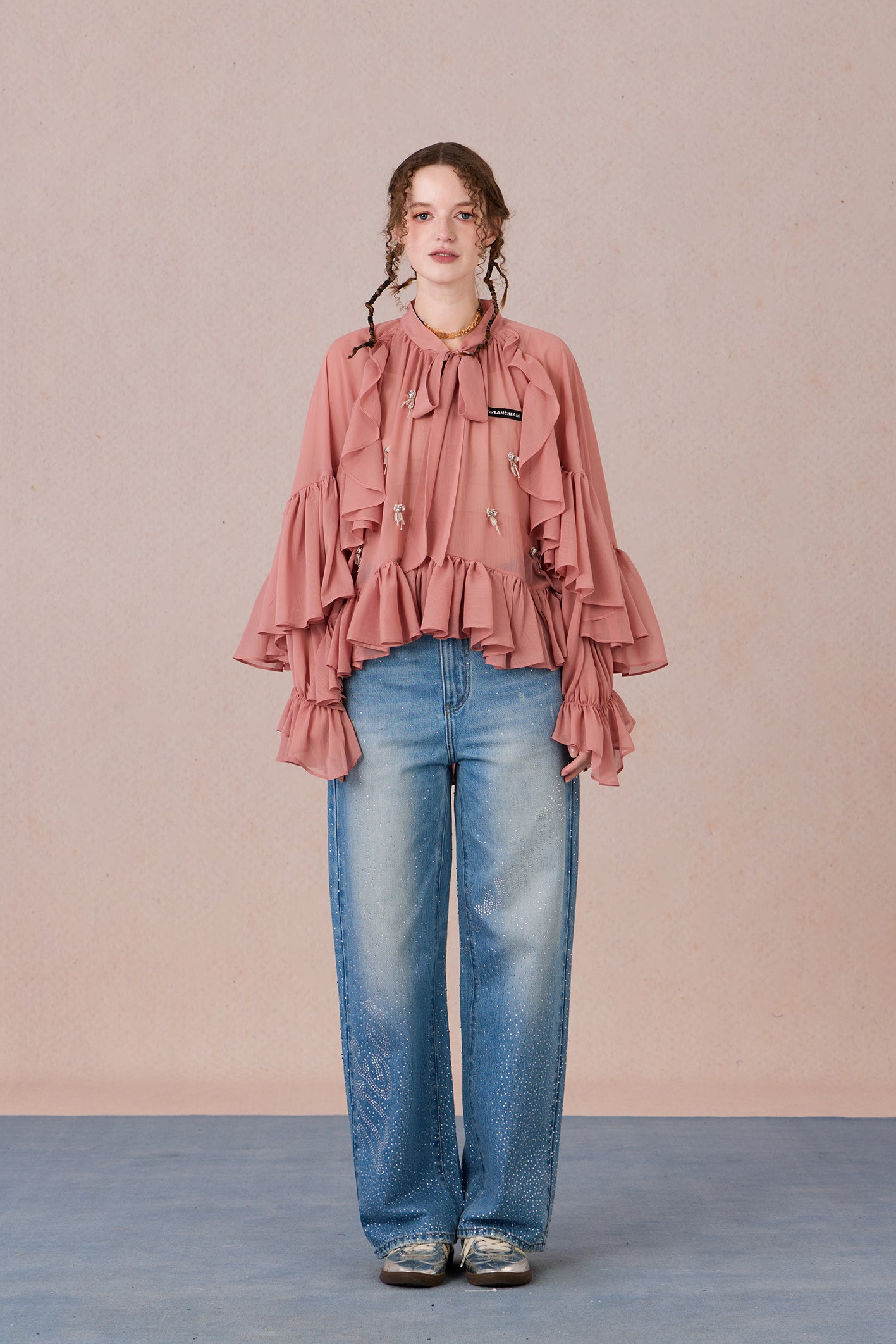 Sheer romantic blouse with flowing silhouette and tulle texture