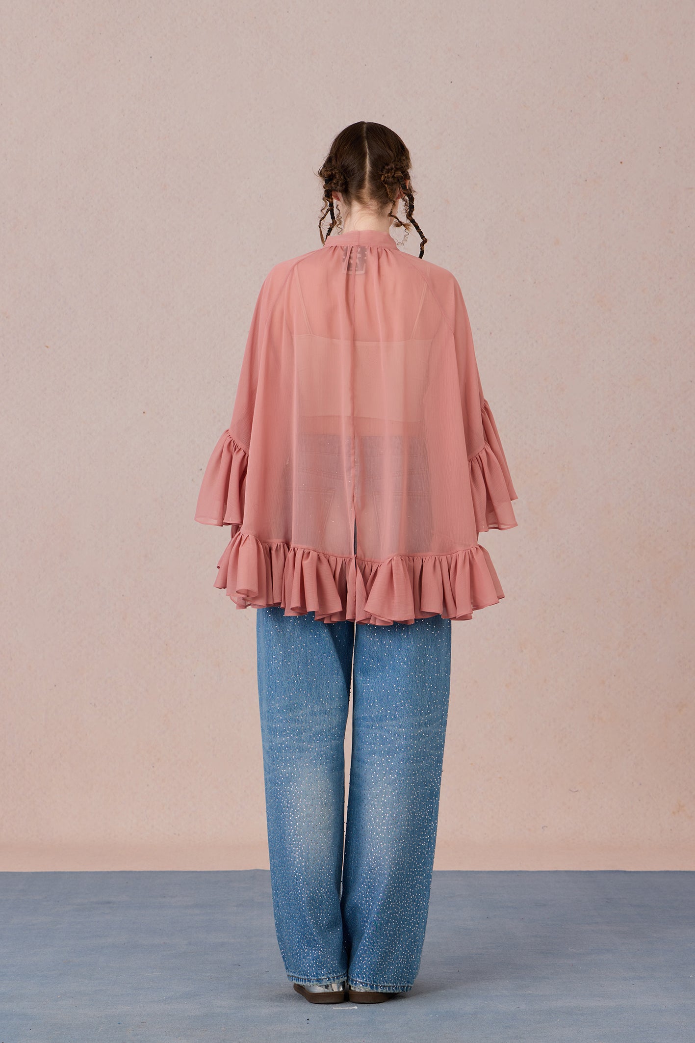 Sheer romantic blouse with flowing silhouette and tulle texture