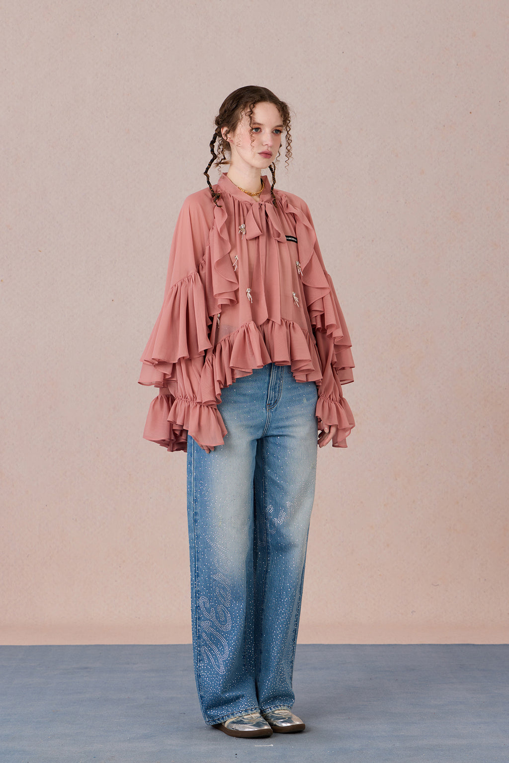 Sheer romantic blouse with flowing silhouette and tulle texture