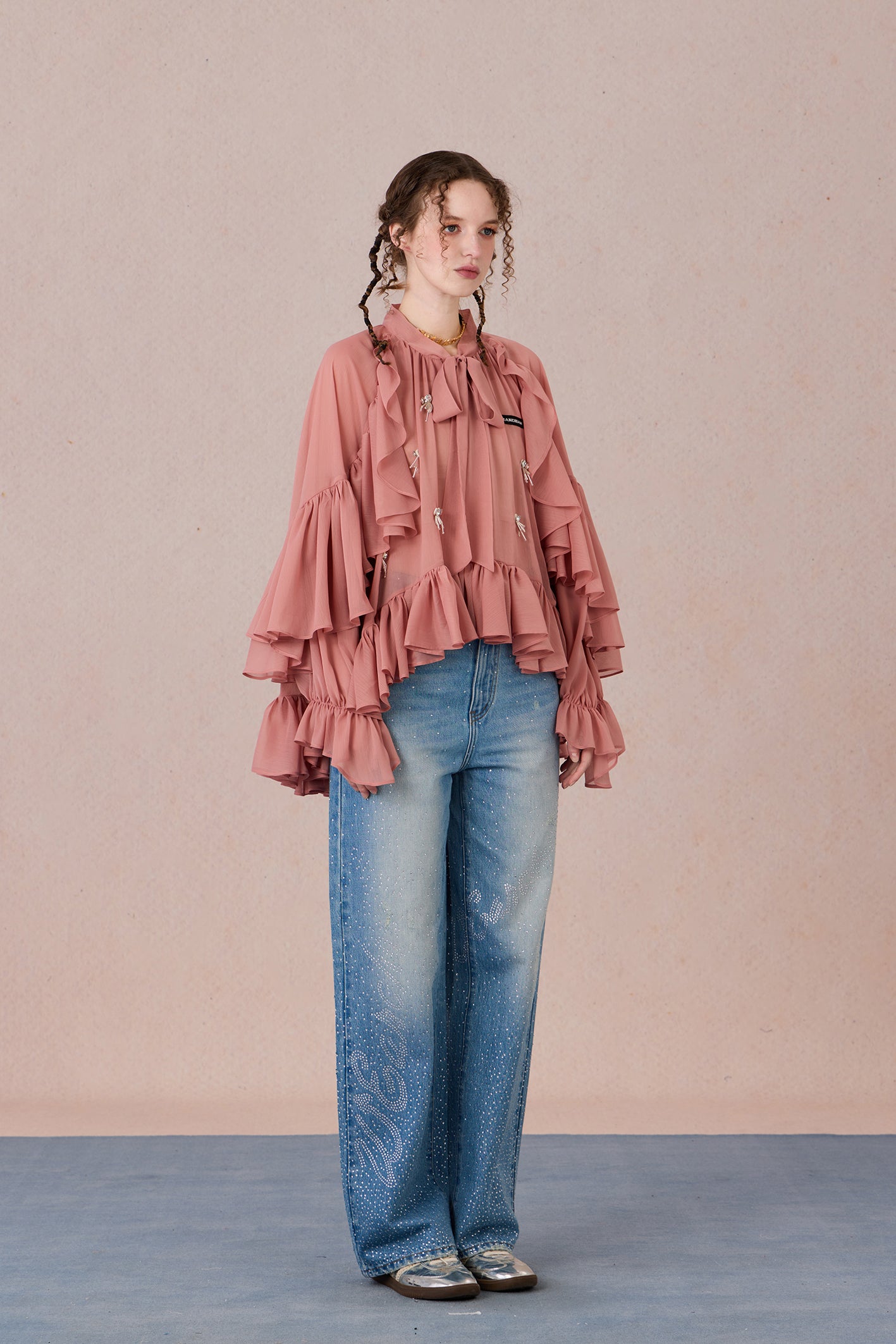 Sheer romantic blouse with flowing silhouette and tulle texture