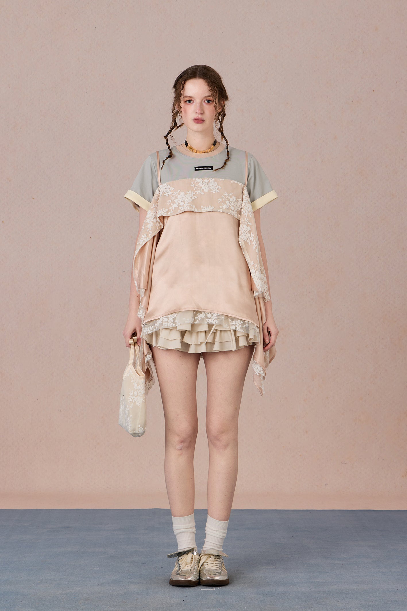 Romantic two-piece look blouse paired with trousers