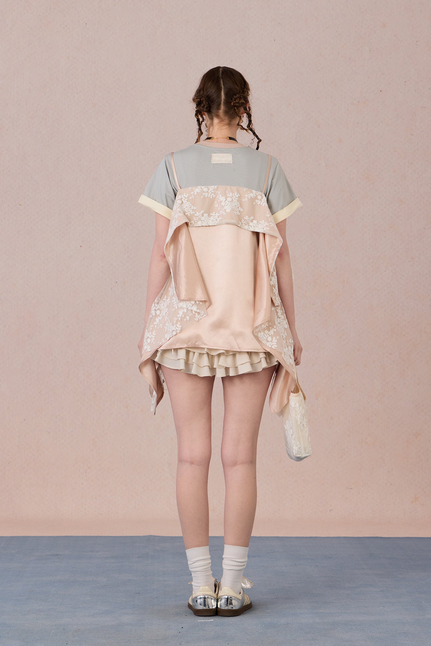 Romantic two-piece look blouse paired with trousers