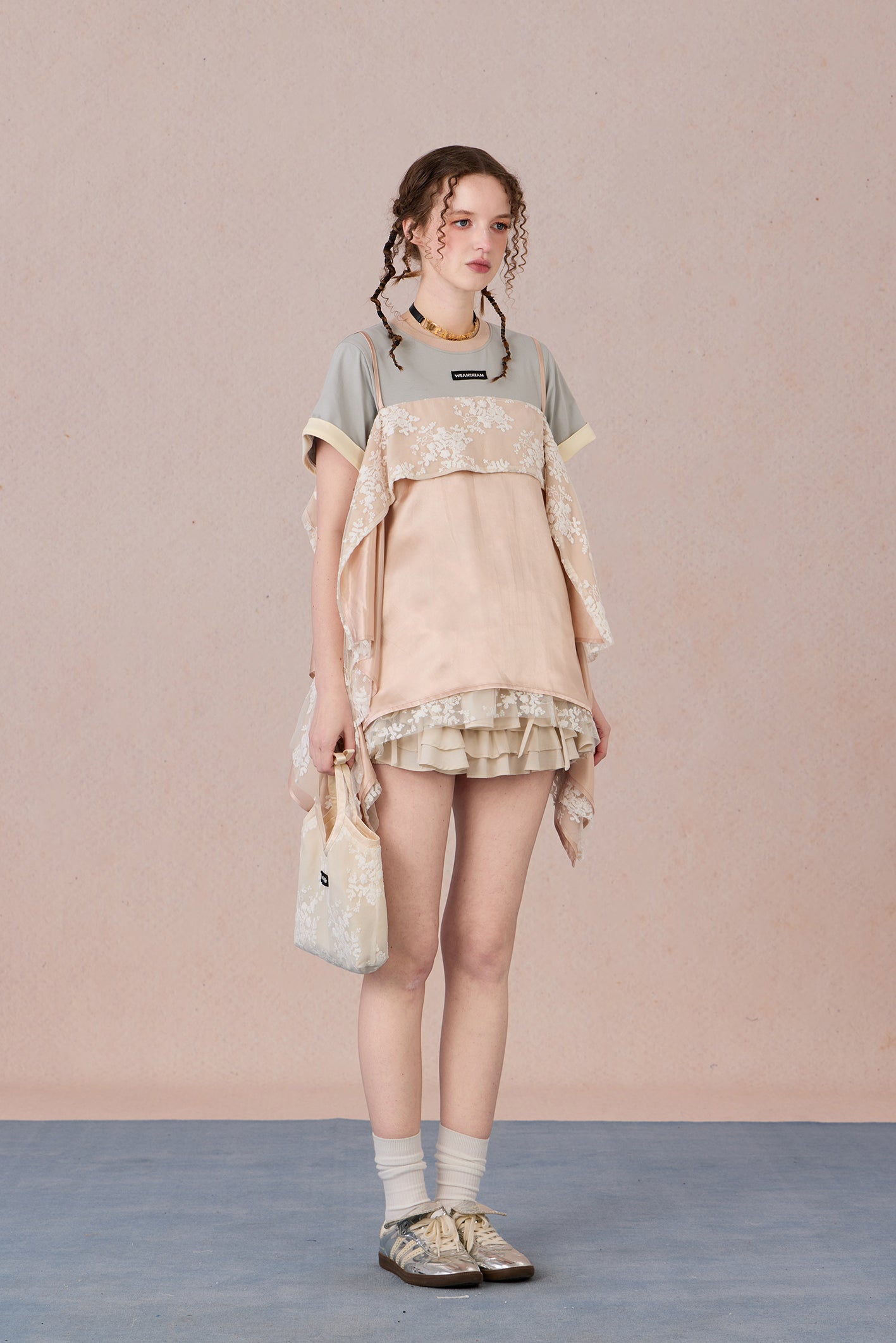 Romantic two-piece look blouse paired with trousers