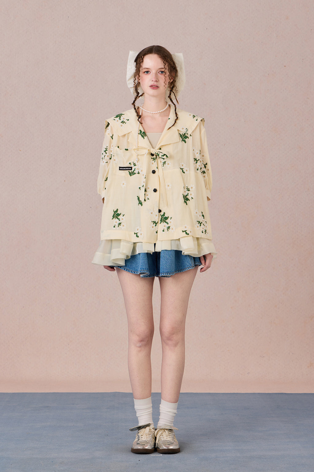 V-neck shirt with tie detail and soft floral print