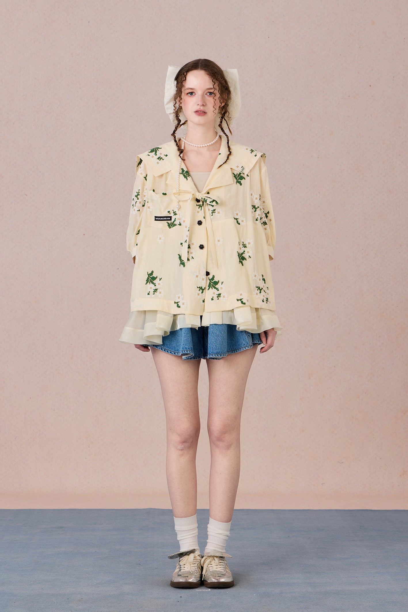 V-neck shirt with tie detail and soft floral print