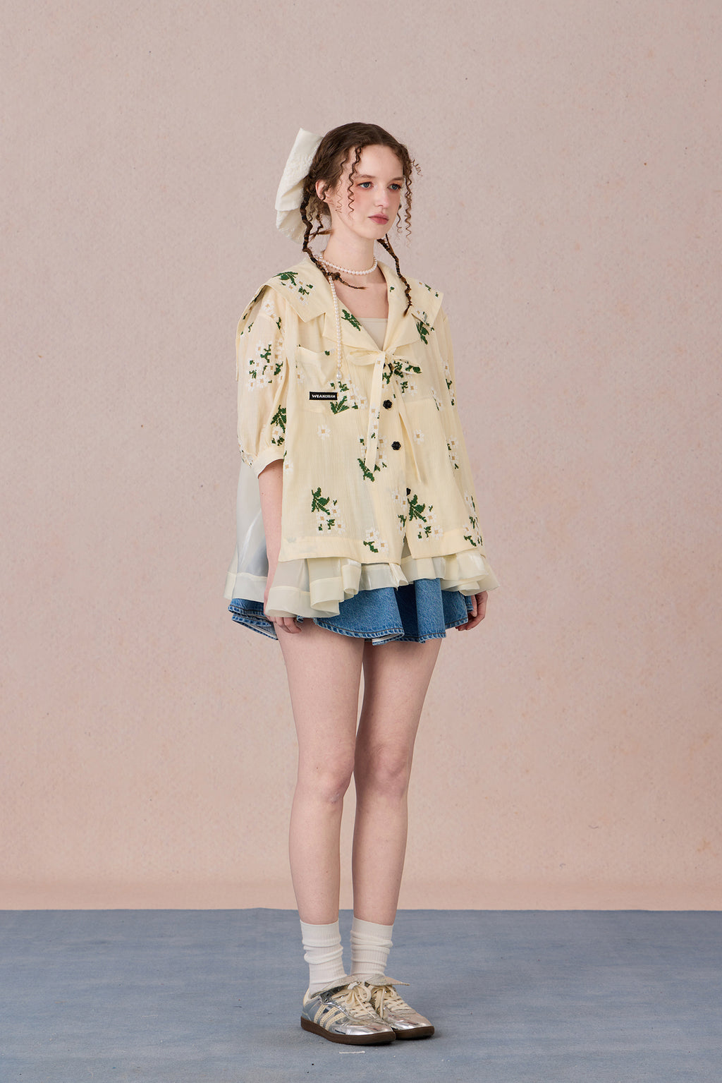 V-neck shirt with tie detail and soft floral print