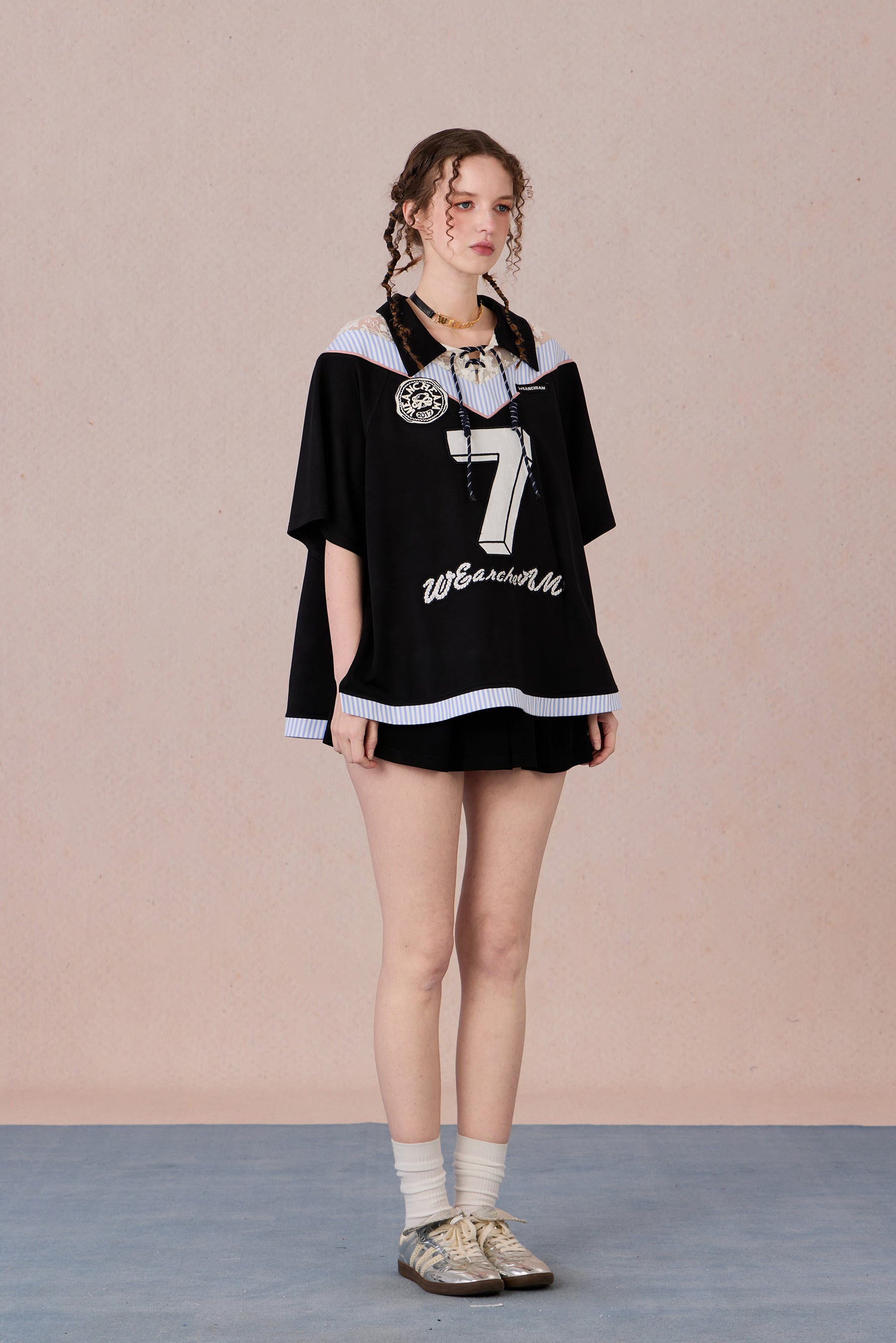 Feminine streetwear tee with mesh panels and loose fit