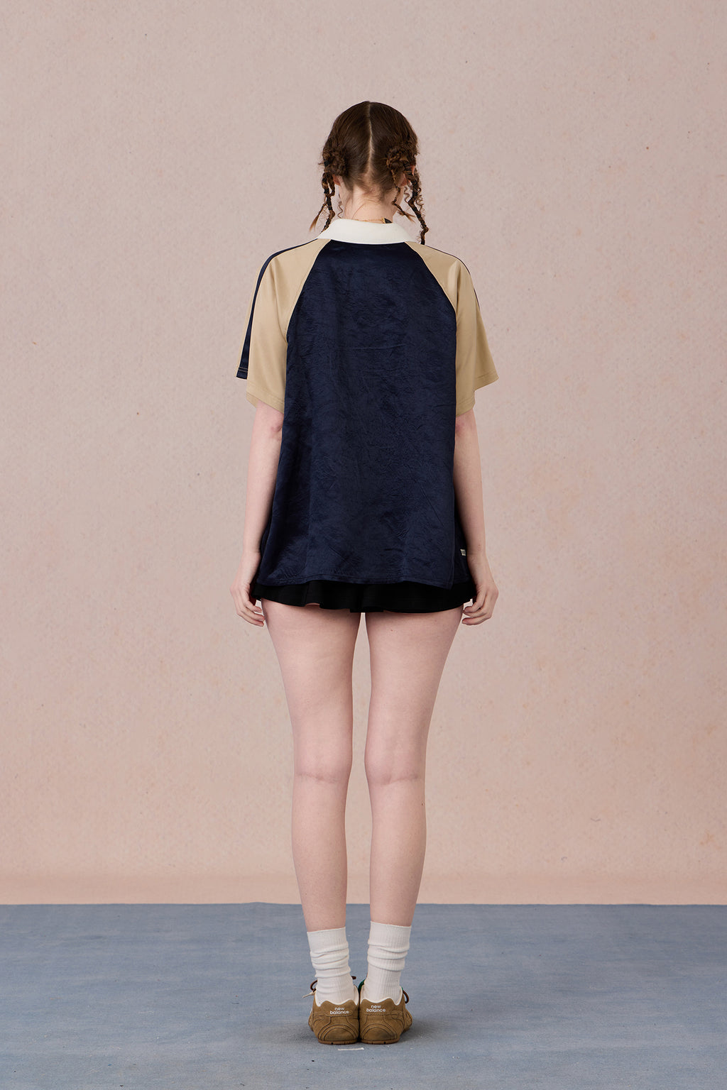 Soft draping silhouette with modern Chinese-inspired neckline